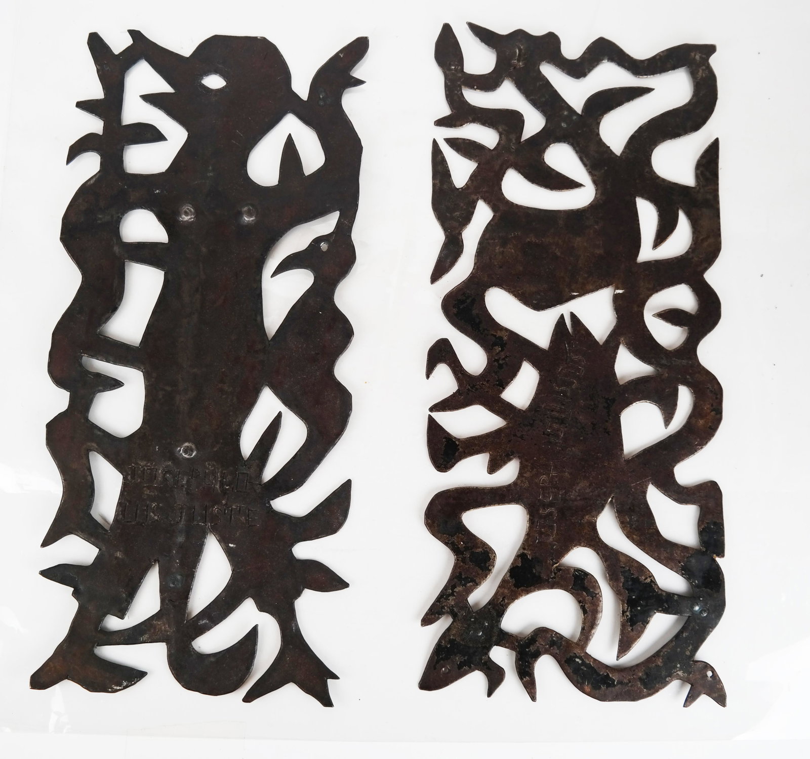 Joseph Louis JUSTE: Two Wall Sculptures: Folk Art cut-out metal wall sculptures, one of a bird, the other of a fish and a whale, both signed by Joseph Louis Juste (Haitian, 20th century). [18 1/4" H x 8" W].
