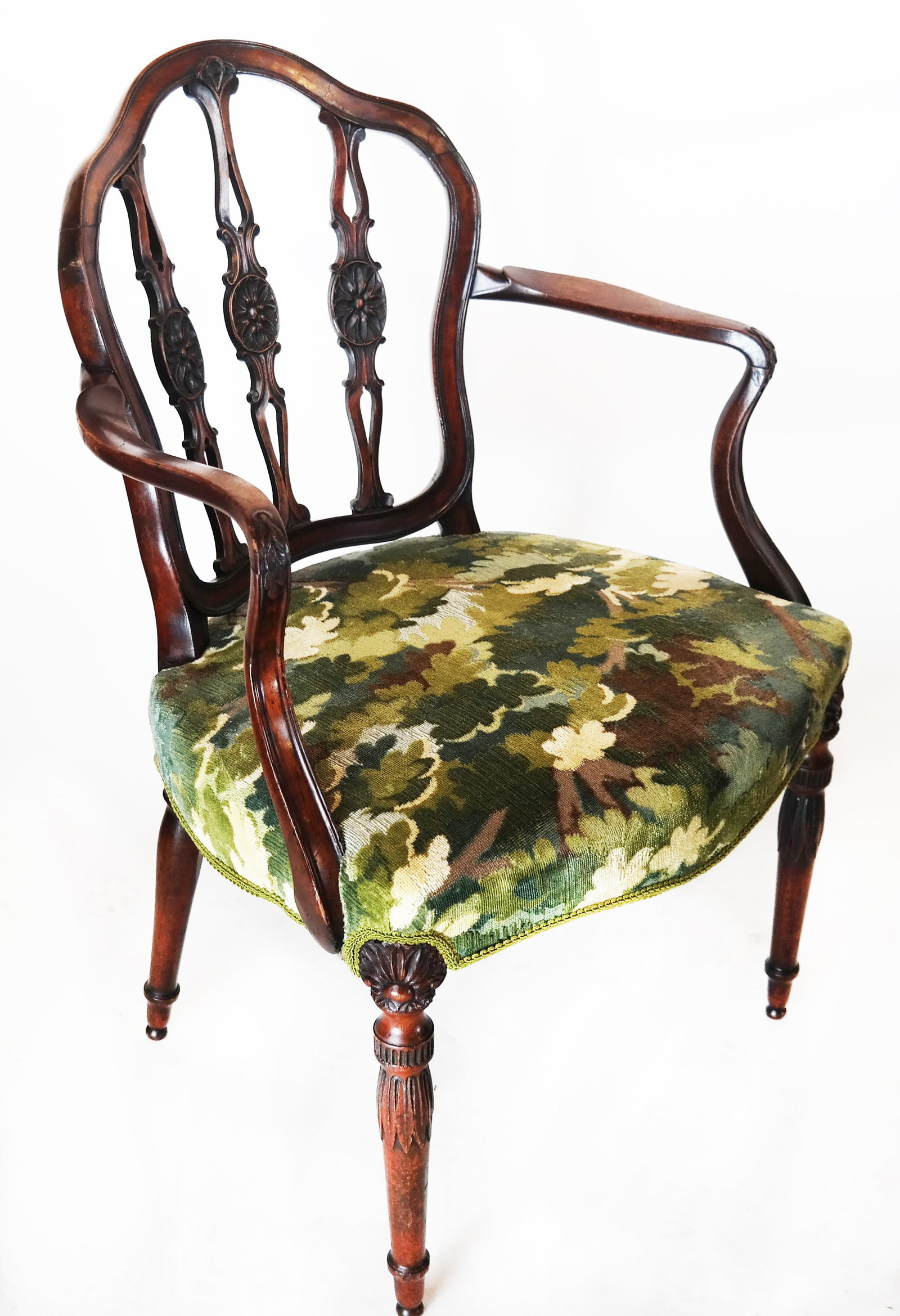 Mahogany Arm Chair, Green Upholstery: Carved mahogany arm chair with modern green floral plush upholstery, having carved florettes on the splat. [36 1/4" H x 24" W x 19" D]. In good condition.
