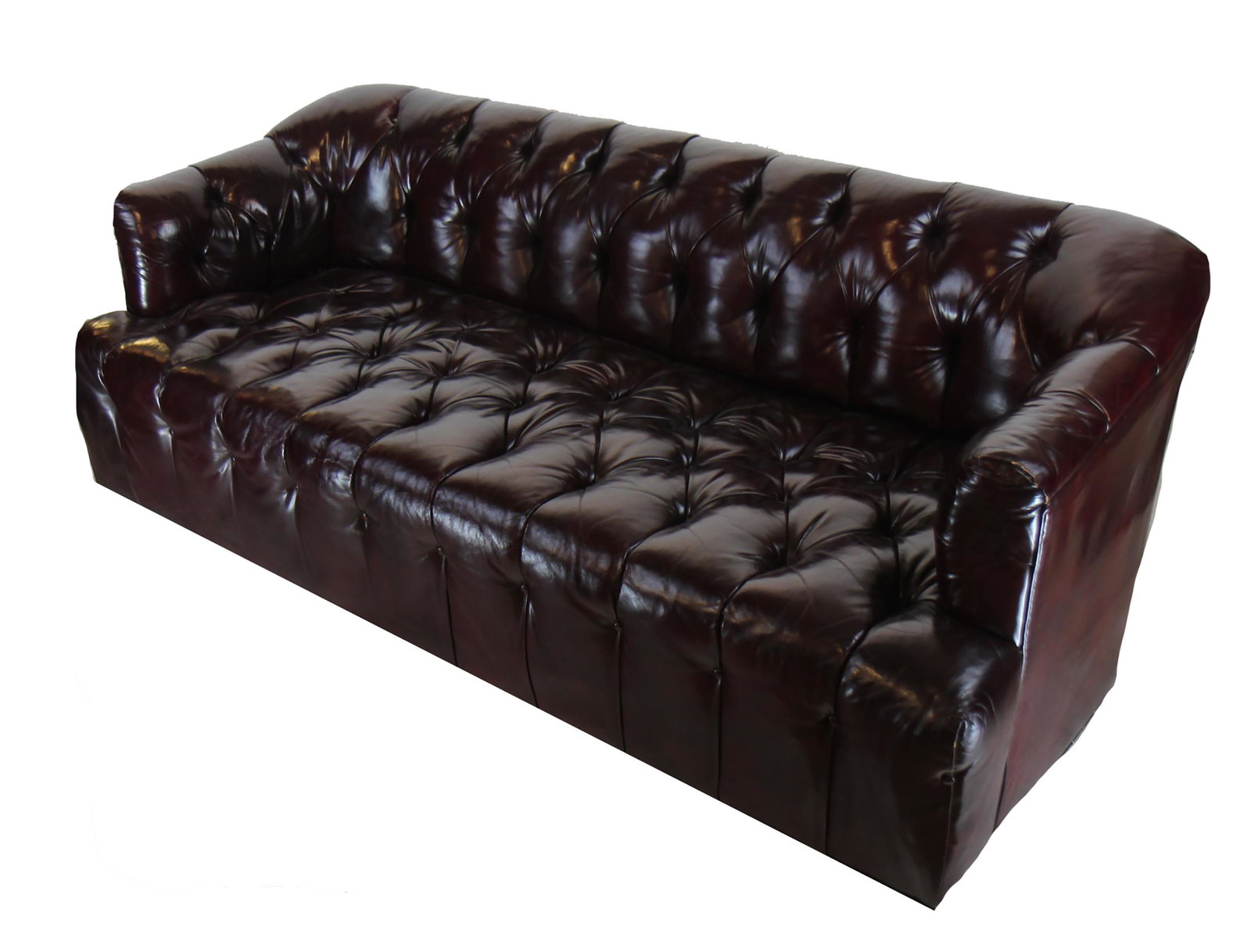 Burgundy Leather Chesterfield Sofa: Chesterfield tufted sofa, burgundy color, possibly leather. Provenance: From 303 E. 57th Street, NYC. [38" H x 78" W x 28" D (approx. measurements)]. Wear along bottom front.