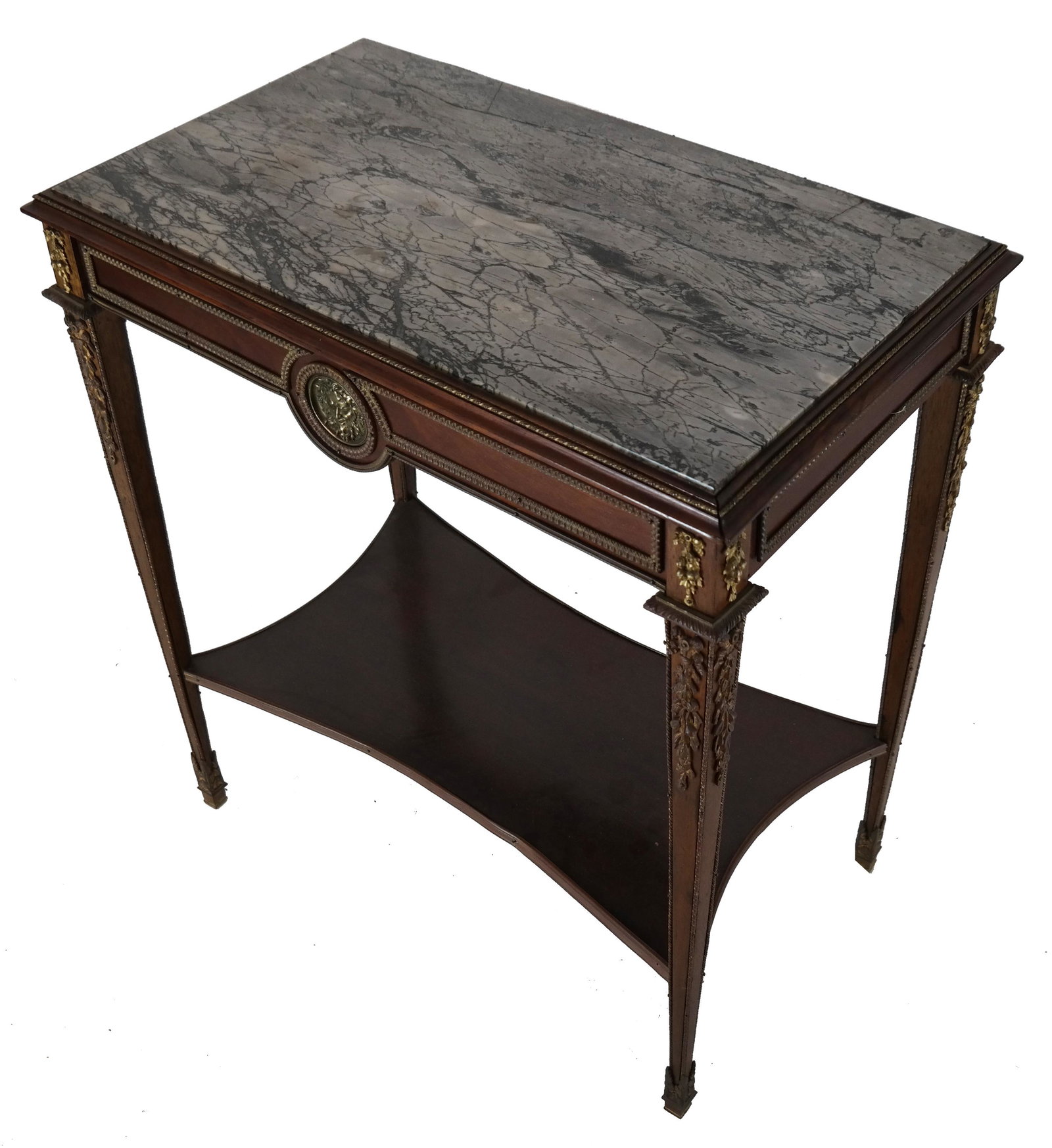 Louis XVI-Style Marble Top Table: Louis XVI-style two-tier mahogany table, with one drawer, bronze mounted, with gray St. Anne marble top. Circa 1920. [29 1/2" H x 27 1/4" W x 16" D]. One mounting loose; marble top cracked.