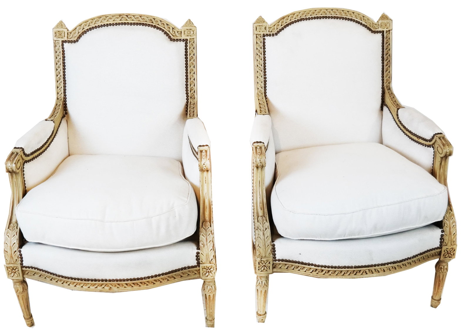 Pair Jansen-Manner Classical Bergeres: Pair of cream painted Jansen-manner bergeres, with muslin upholstery. Provenance: Malmaison - Roger Prigent Enterprises. [36 1/2" H x 26" W x 20"D; 14 1/2" to seat].