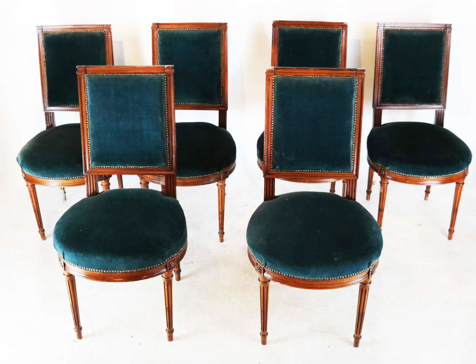 Set of Six Louis XVI-Style Side Chairs: Set of six Louis XVI-style side chairs, in the manner of Jansen, with green upholstered seats. Provenance: Malmaison - Roger Prigent Enterprises. [36 1/2" H x 19" W x 17" D; 18" to seat].