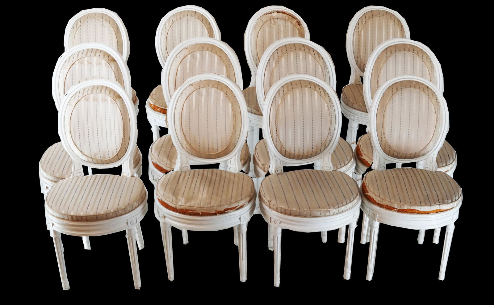 Set of Twelve Jansen Balloon Chairs: Set of twelve Jansen white painted and caned wood side chairs, with oval-shaped padded and upholstered back rest, stamped "JANSEN". Provenance: Malmaison - Roger Prigent Enterprises. [36" H x 18" W x