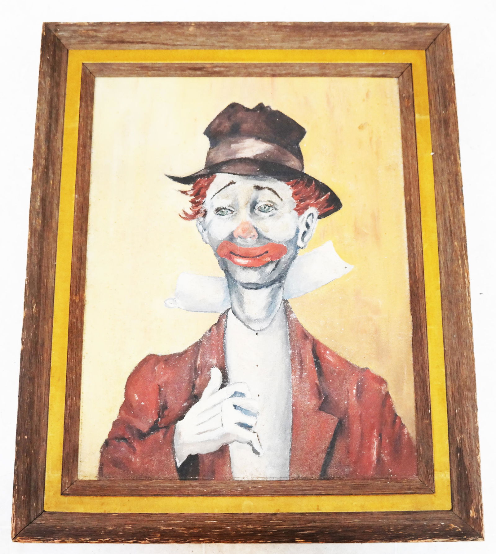 Portrait of a Clown - Oil on Masonite Painting: Bust-length full profile portrait of a clown wearing a hat. Framed. [Sight: 27 1/2" H x 21 1/2" W; Frame: 35" H x 29" W]. Surface grime, soiling, abrasions. From the collection of Spencertown Art & An