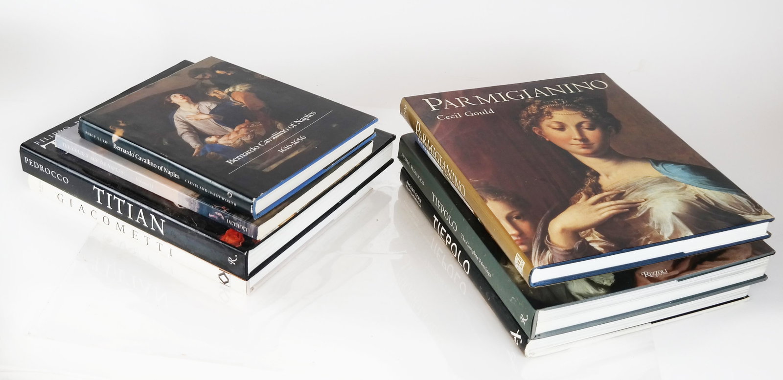 Lot of 8 Books of Italian Art & Artists: Lot includes coffee table size books on Titian, Tiepolo (2), Giacometti, De Mura, Cannellino, Parmigiana and the Art of Naples. All in good condition.