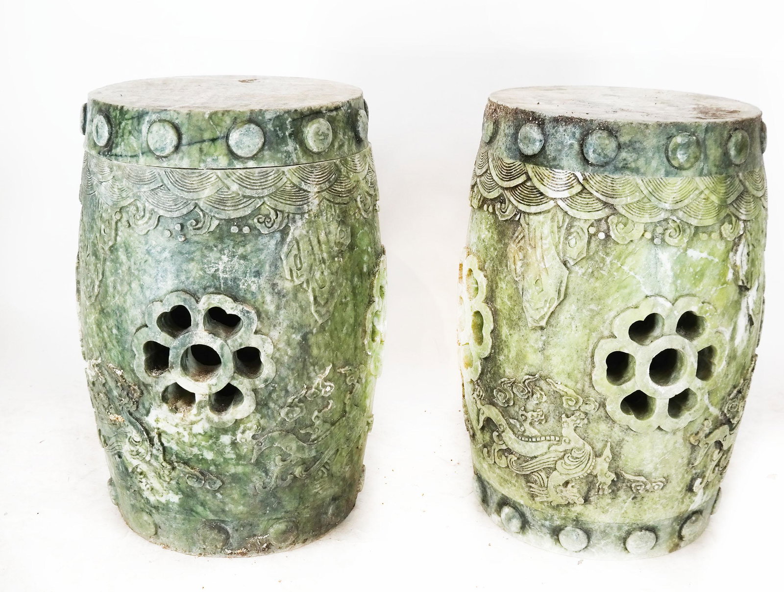 Pair of Chinese Marble Garden Stools: Pair of Chinese marble relief and open work design garden seats. [[17 1/2" H x 12" Diam.]. One with repaired top section.