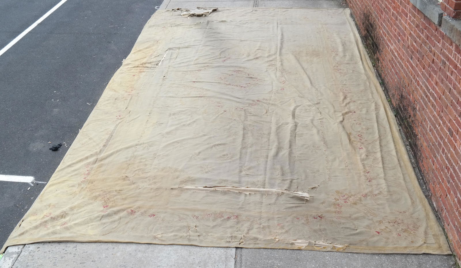Palatial Aubusson Rug: Palatial Aubusson rug. [11' 10" x 21' 9"]. In very poor condition overall, with extreme wear and tears; some areas suitable for re-purposing.