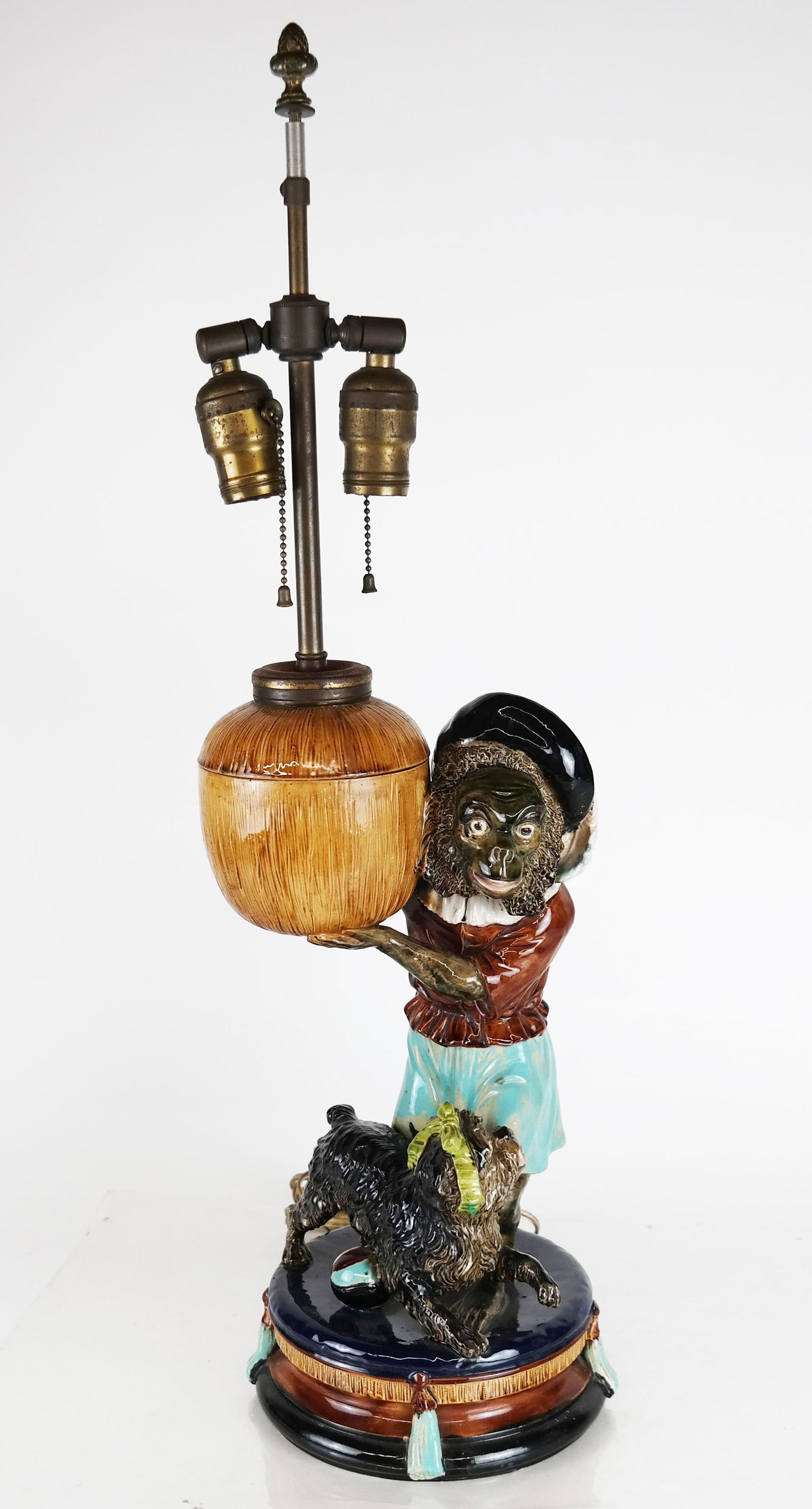 Minton Majolica Monkey & Dog, as Lamp: Minton majolica sculpture of a monkey with a coconut, and a dog, mounted as a lamp. [27 1/2" H (to top of finial); Sculpture only: 15 1/2" H x 7 1/2" W x 7 1/2" Diam. (base)].