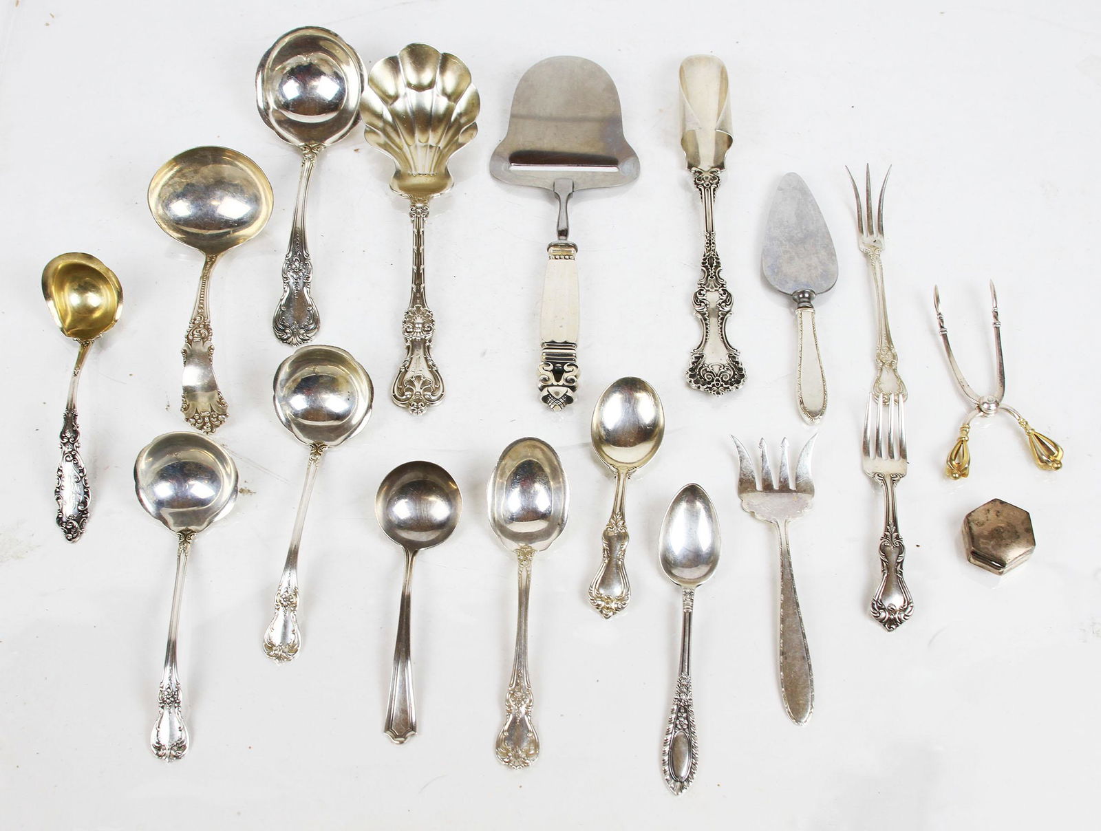Mixed Lot Sterling Silver Flatware & Servers: Mixed lot of sterling silver flatware and serving pieces, including a George Jensen server. Combined weight 21.20 ozt.