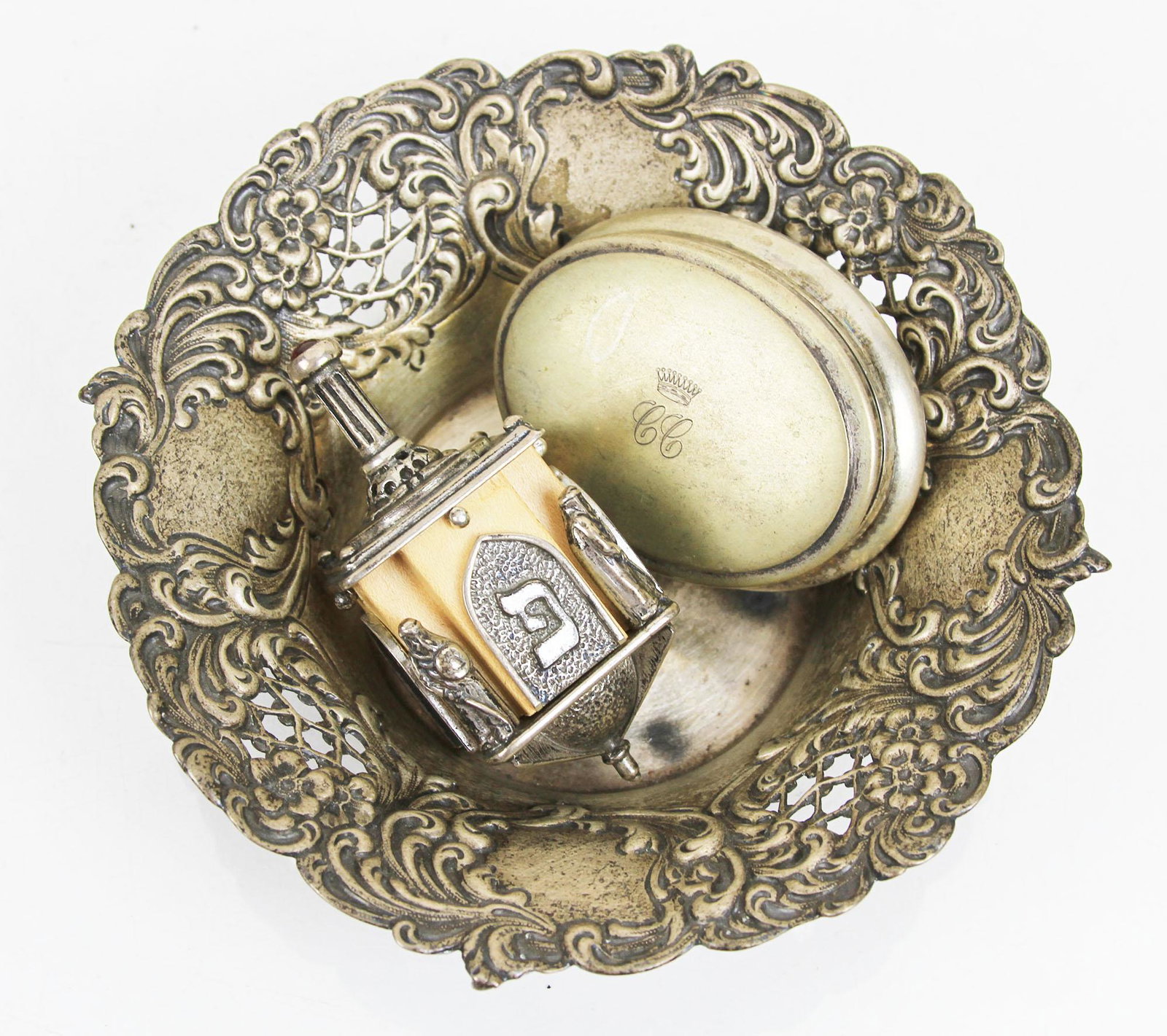 Three Silver Items: Box, Bowl, Dreidel: Lot includes a sterling silver-clad dreidel [3" H x 1 1/4" W x 1 1/4" D], an .800 silver monogrammed oval box, 1.445 ozt. [3/4" H x 2 1/4" W x 2" D], and a Gorham sterling silver repousse bowl, 2.17 o