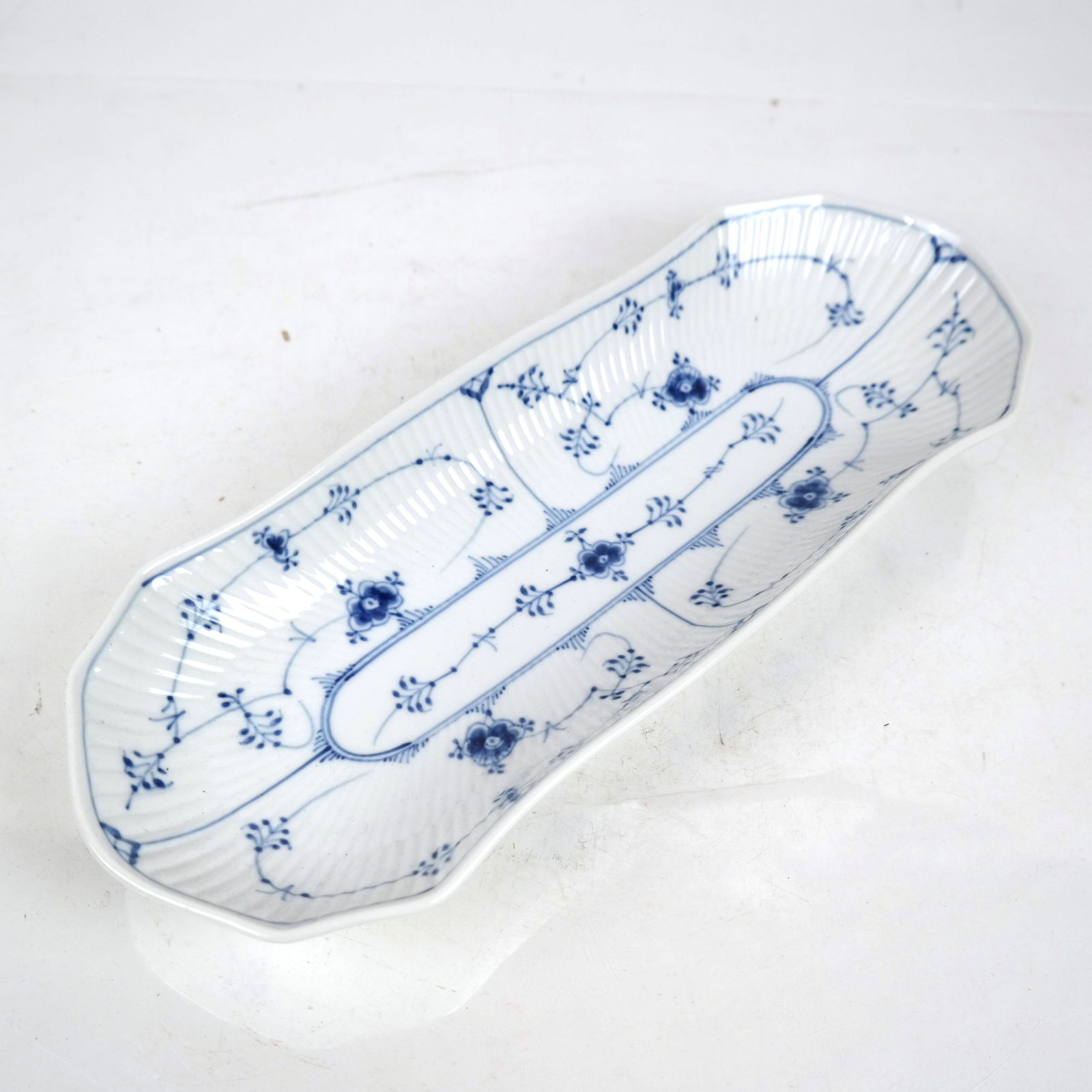 Royal Copenhagen Blue Fluted Full Lace: Royal Copenhagen oval charger dish, Arnold Krog design. [1 3/4" H x 14 1/4" W x 5 1/4" D].