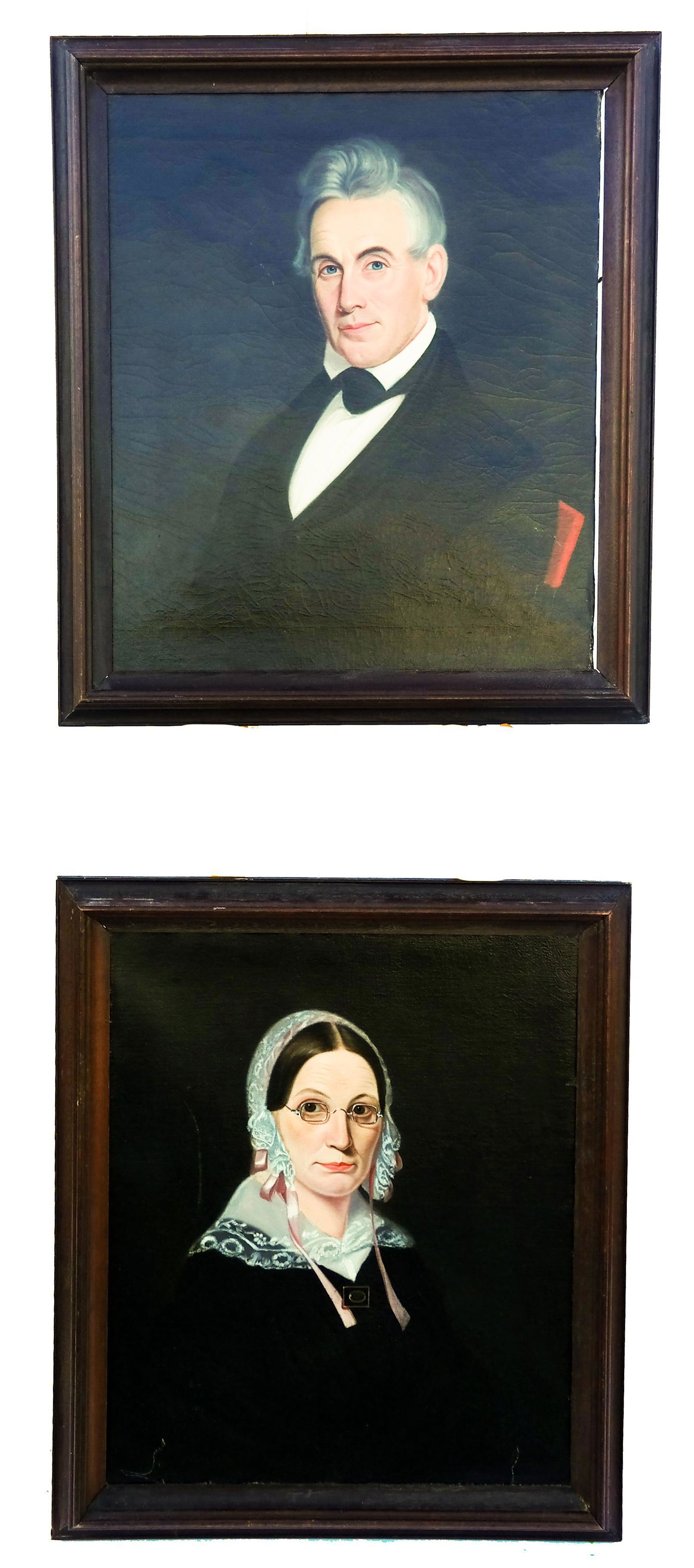 Ammi PHILLIPS: Pair of Portraits - Paintings: Pair of Folk Art oil on canvas portraits, of a gray-haired gentleman and a lady in a white lace collar, attributed to Ammi Phillips (American, 1788-1865). [Art: 26-26 1/2" H x 23-23 1/2" W]. In good c