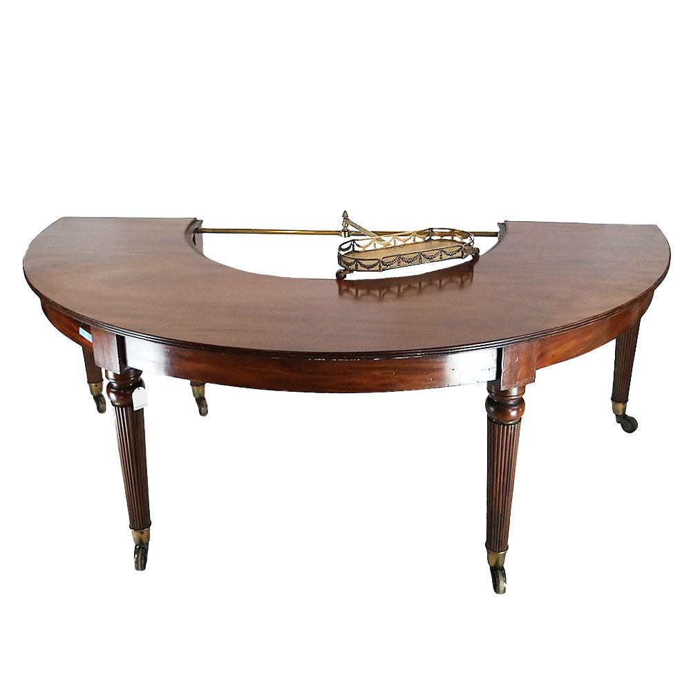 19th C. George IV Mahogany Wine Table: Antique mahogany wine table, having reed form legs on casters, with a bronze floral design tray on wheels. Provenance: Sotheby's, Oct. 18, 2016 sale, lot 291. [28 3/4" H x 80 1/2" W x 43" D].