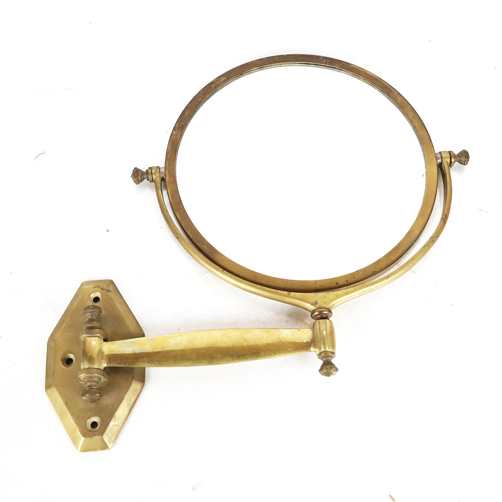 Wall-Mounted Brass Mirror: Wall-mounted brass mirror by Le Mirophar BROT. [Mount: 5 1/2" H x 8" W; Mirror" 10 1/2" H x 12" W].