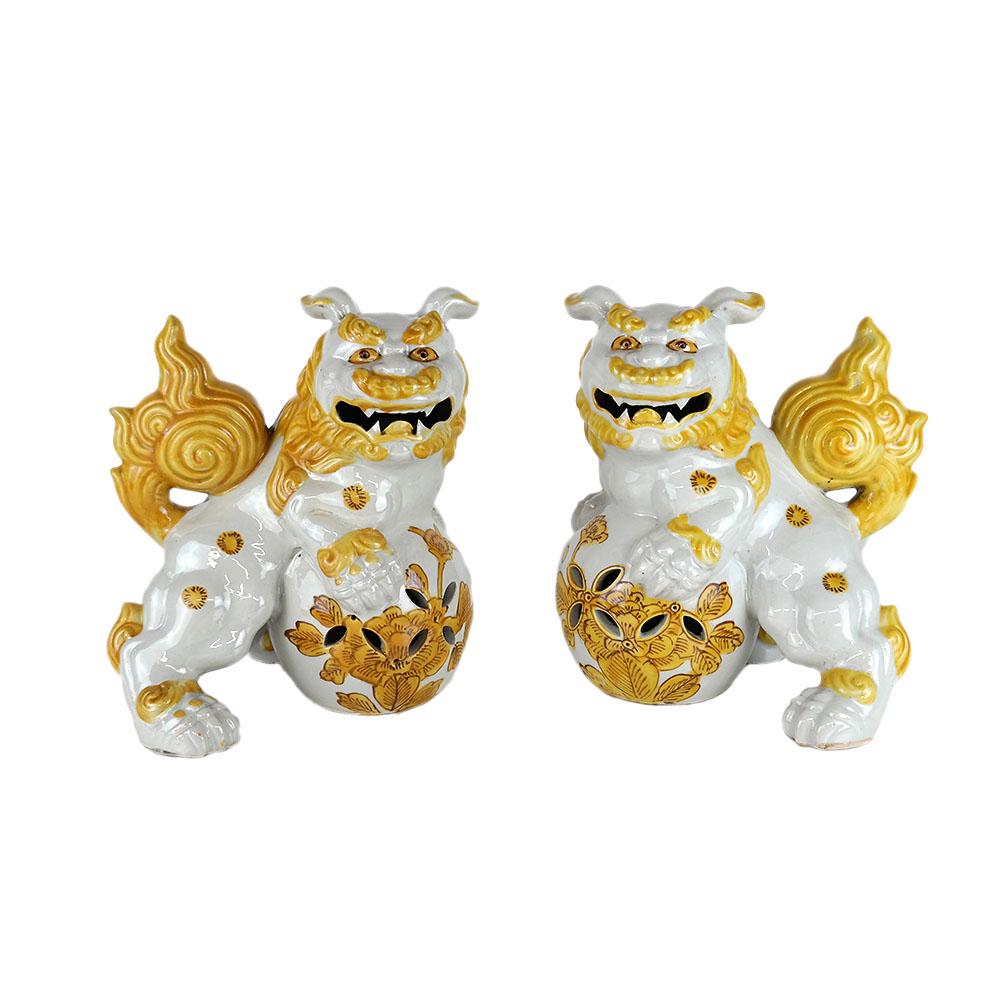 Pair Chinese White & Yellow Glazed Foo Dogs: Pair of yellow and white glazed foo dogs. [9" H x 7 1/2" W x 6 1/2" D].