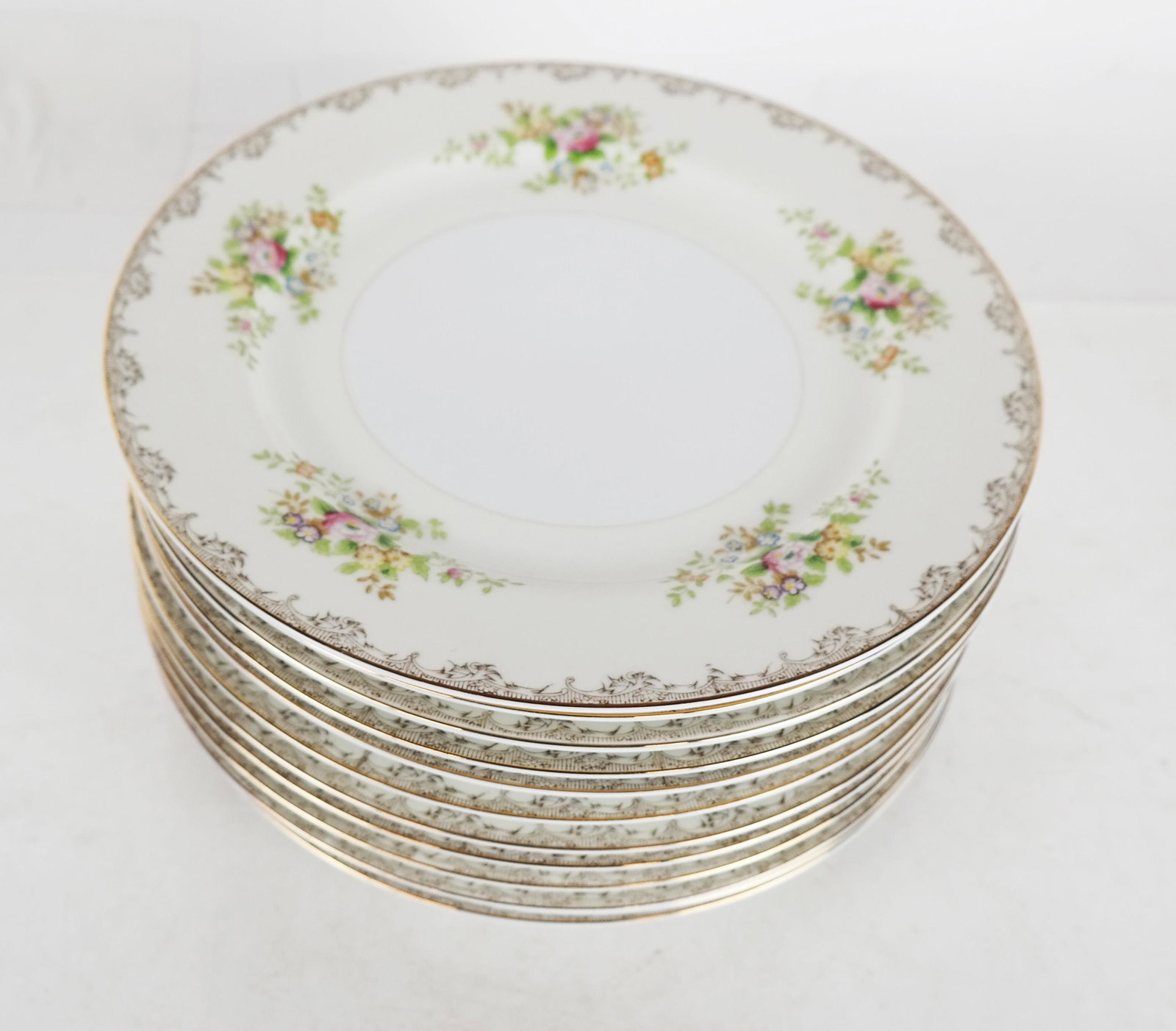 Twelve Japanese Floral Dinner Plates: Twelve Meito china hand painted porcelain plates. [10" Diam.]. All in good condition.
