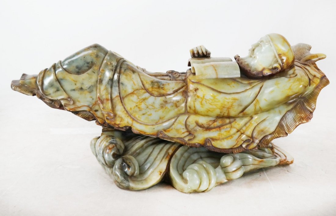 Chinese Soapstone Sculpture of a Man: Chinese sculpture of a reclining man, asleep. [12" H x 32 1/2" W x 13 1/2" D].