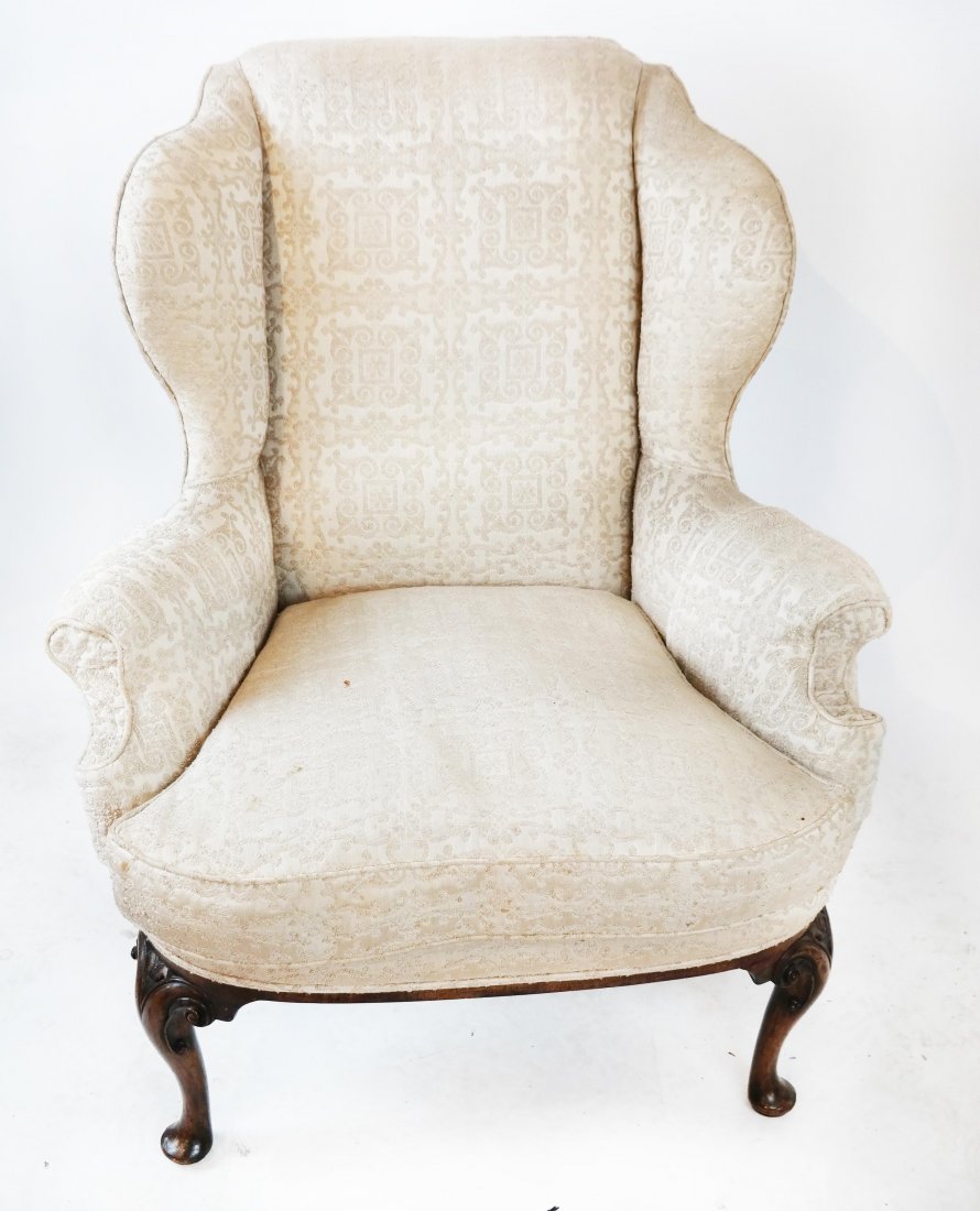 Queen Anne-Style Wing Chair: Queen Anne-style wing chair, by F. Parker & Sons, England. [44" H x 34" W x 23" D; 15 1/2" to seat]. Back leg damaged.