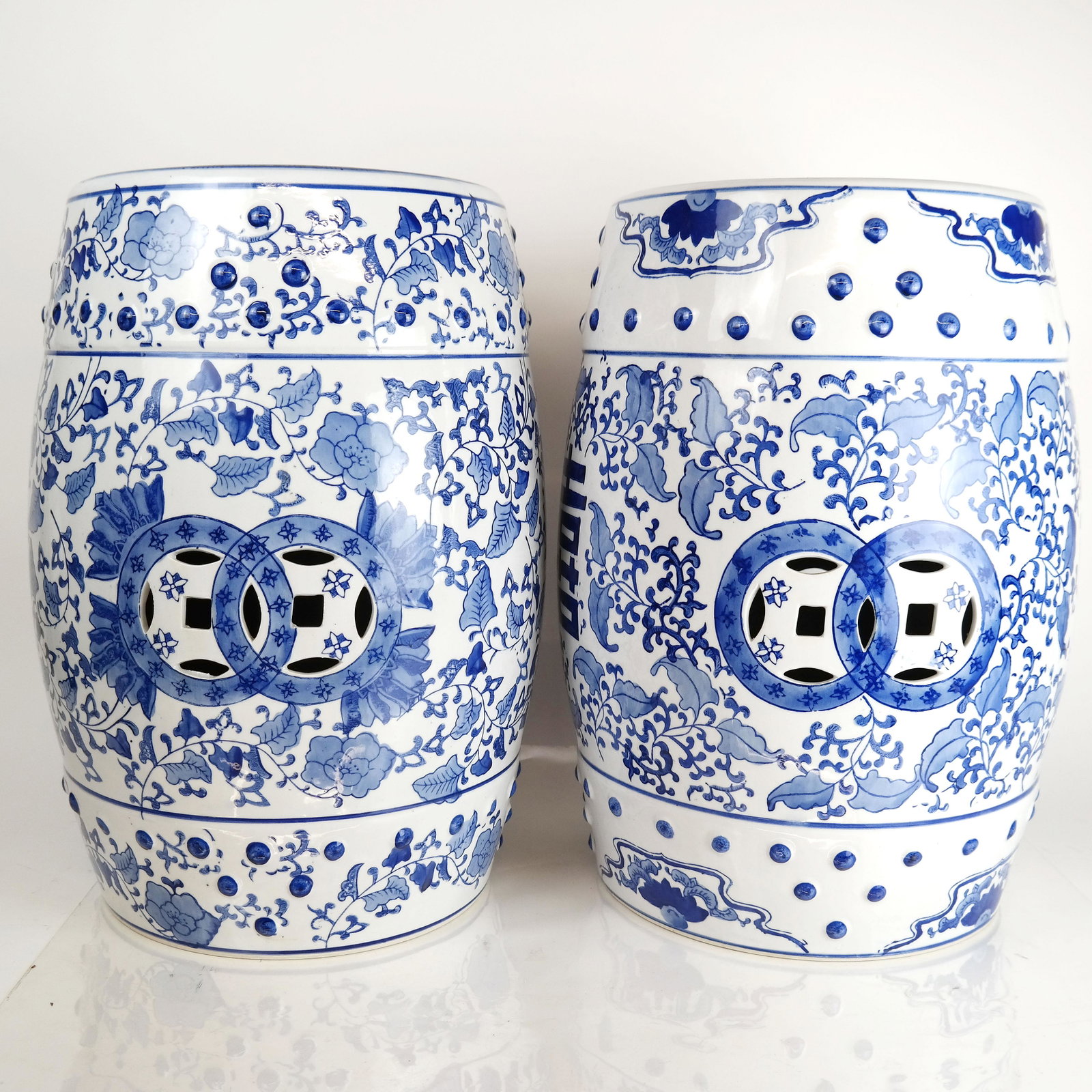 Pair Chinese Blue & White Garden Seats: Pair of Chinese blue and white ceramic garden seats. [18" H x 12" Diam.]. In good condition.