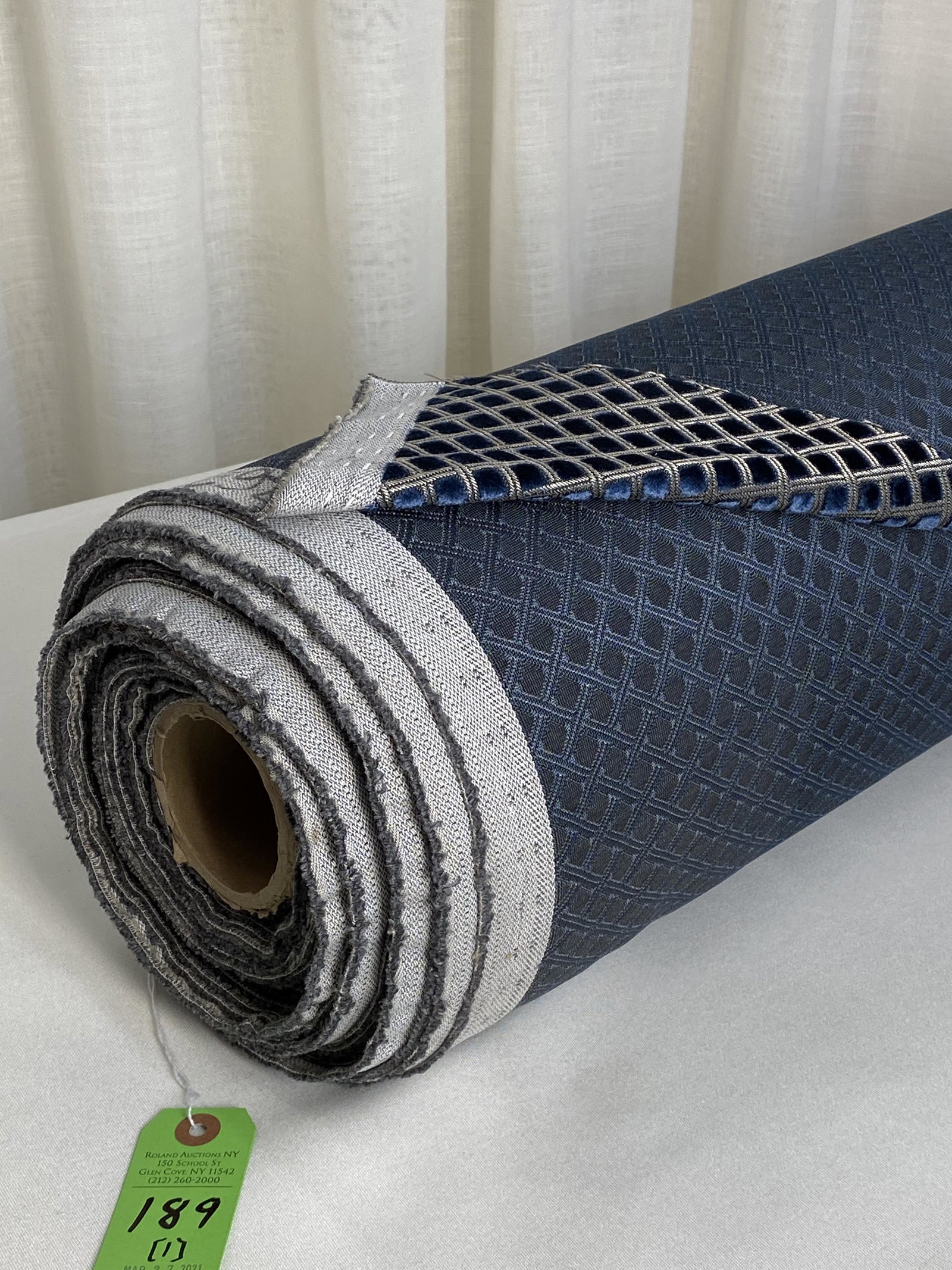 JAB/Aristoetz Hospitality Velvet Fabric: 40-yard bolt of JAB/Anstoetz navy on beige cut and voided small scale diamond synthetic velvet, called "Assisi", 57" wide. The polyester hospitality upholstery figured jacquard reveals a fair amount o