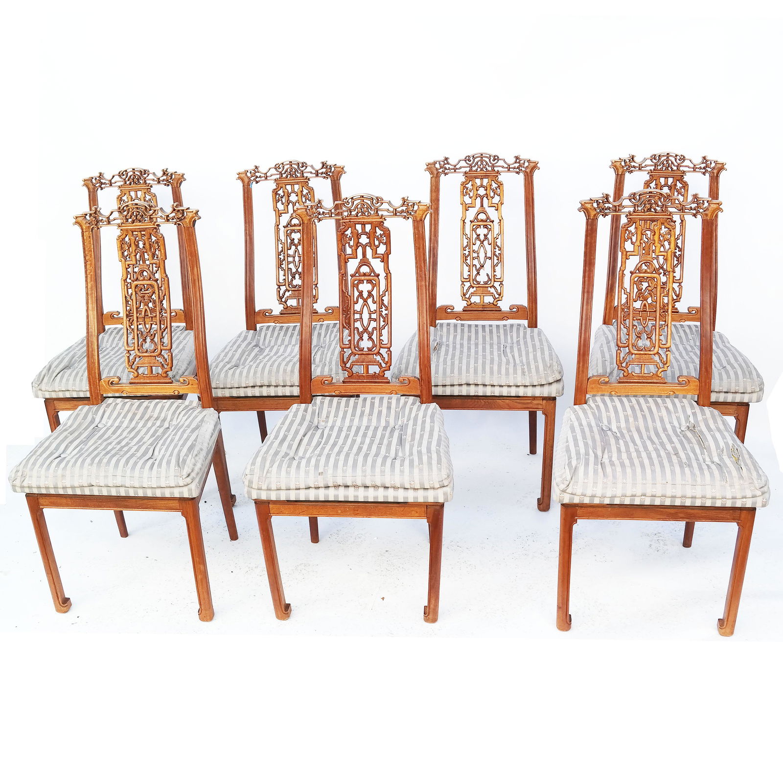 Lot of 7 Chinese Chippendale-Style Chairs: Lot of seven dining chairs, with carved splats and curved backs. Companion to Lot 275. [38" H x 18 1/2" W x 18" D]. Upholstery worn, torn and stained; one chair damaged.
