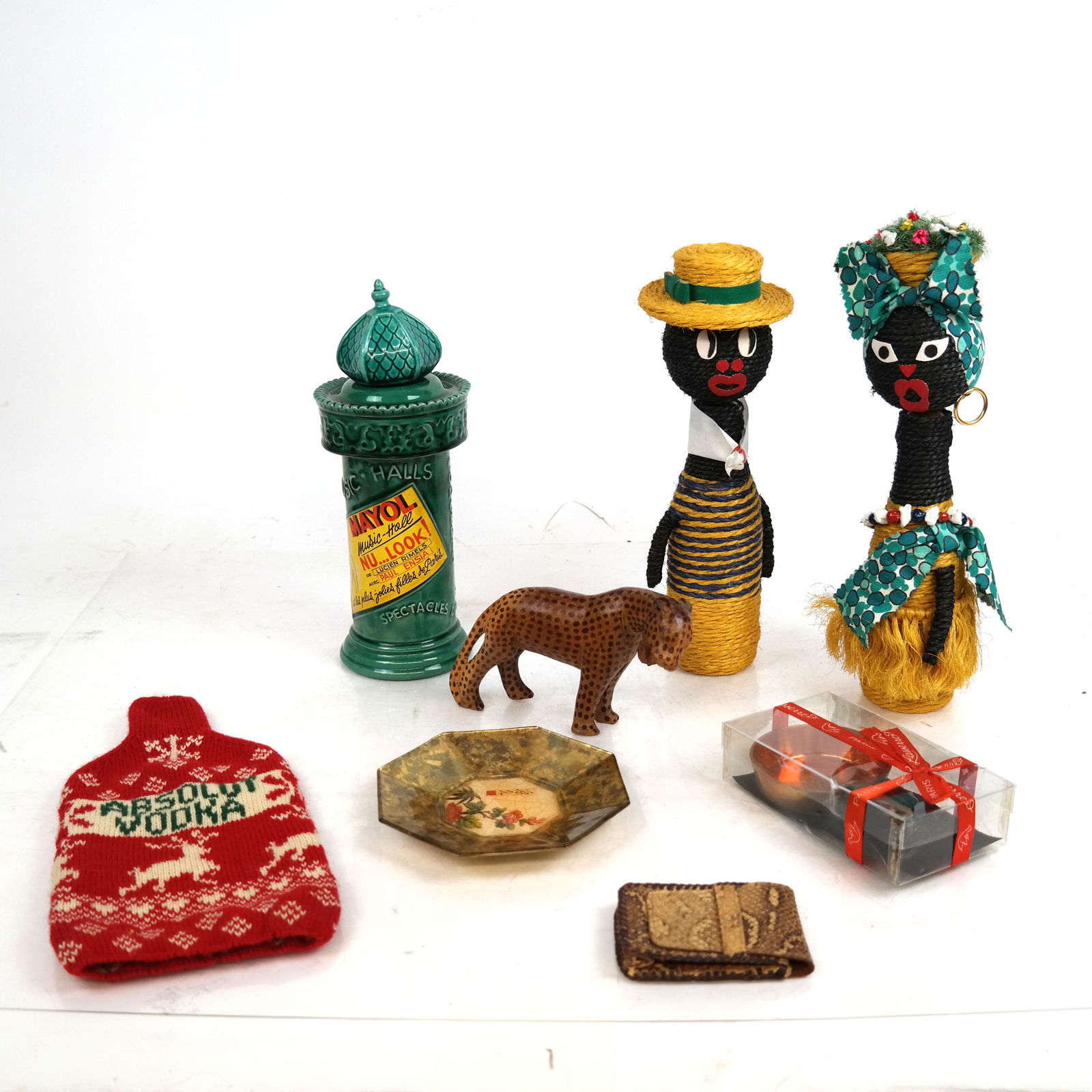 Mixed Lot of Decorative Objects, Others: Lot includes a pair of twine dolls, a majolica liquor bottle, dish, Absolut Vodka bottle cozy, more. [largest (doll): 12" H].