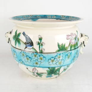 Theodore Deck Faience Porcelain Jardiniere: A porcelain ceramic jardiniere/planter with birds and floral decoration, having elephant-form handles. Provenance: Christie's, April 19, 2016 sale, lot 8. [11" H x 15" Diam.]. In good condition.