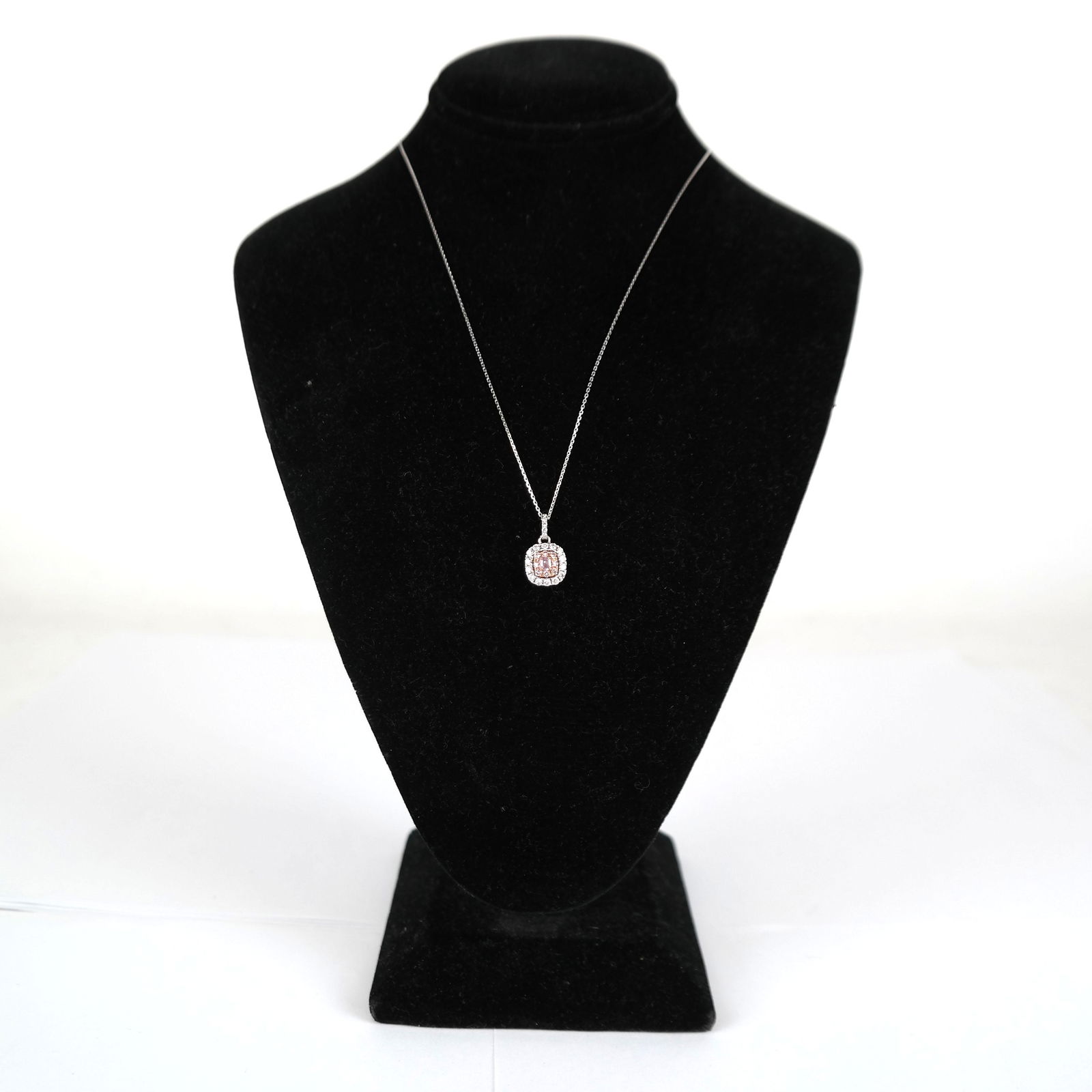 Pink & White Diamond Pendant: 0.11 ct diamond & 0.37 ctw diamond in 18K 1.54 gram pendant. Length 18".