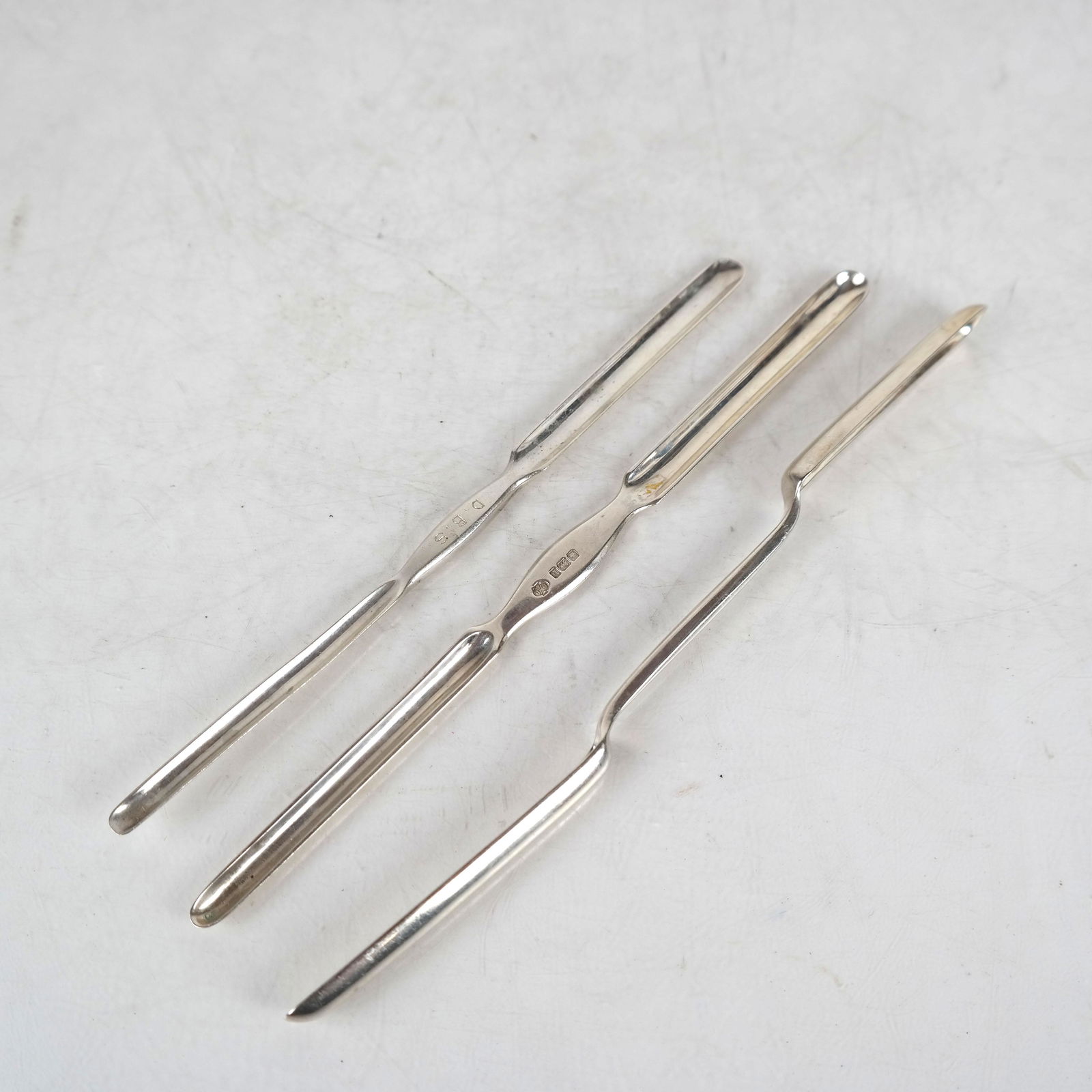 Three Silver Wine Tasting Spoons: Theodore B. Starr, Piccini and William Hutton & Sons spoons, 20th century. 4.5 ozt. [10" L].