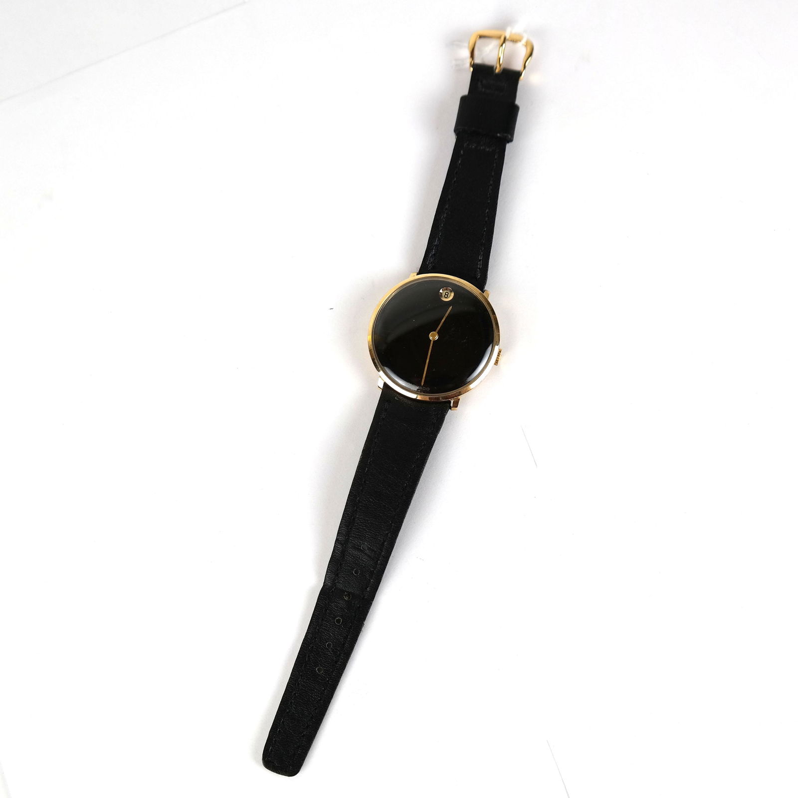 Vintage Movado 14K Wrist Watch: Vintage 14K Movado manual wind wrist watch, with black leather band. Not running.