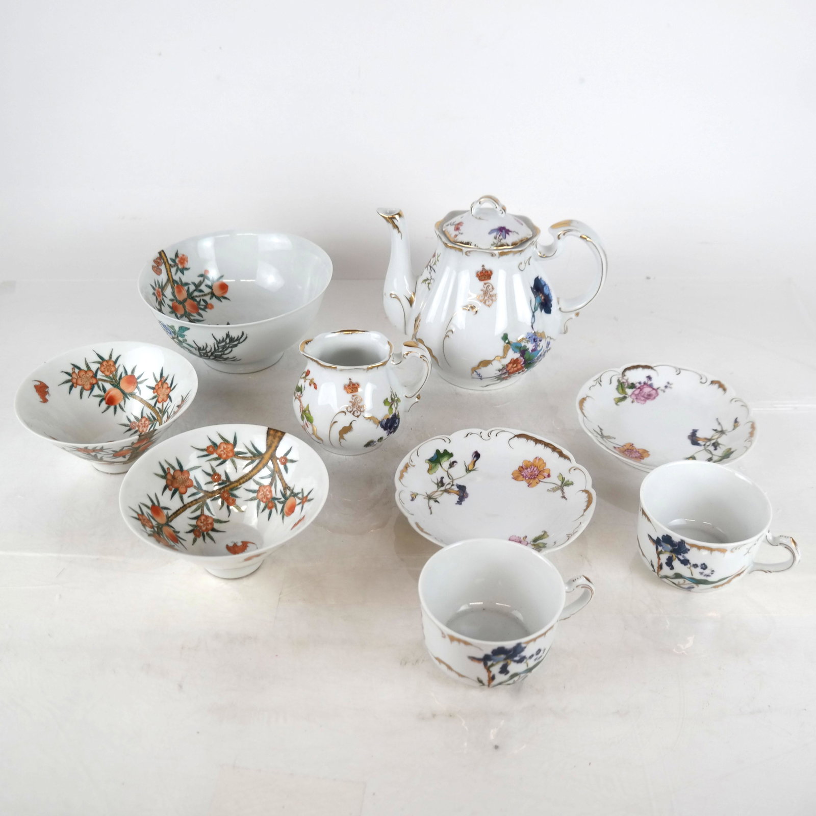 Group of Porcelain Dinnerware: Group includes six Portuguese dessert pieces, including a teapot, sugar bowl, two cups and two saucers, together with three Chinese bowls. All in good condition.