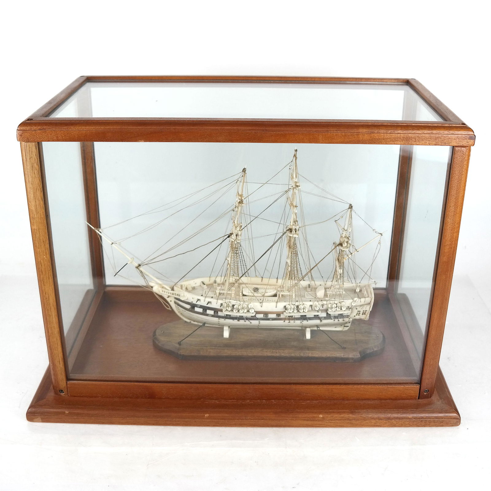 Carved Bone Model Ship in Display Case: Carved bone ship, in display case. [Case: 13 1/2" H x 15 1/4" W x 11 1/2" D].