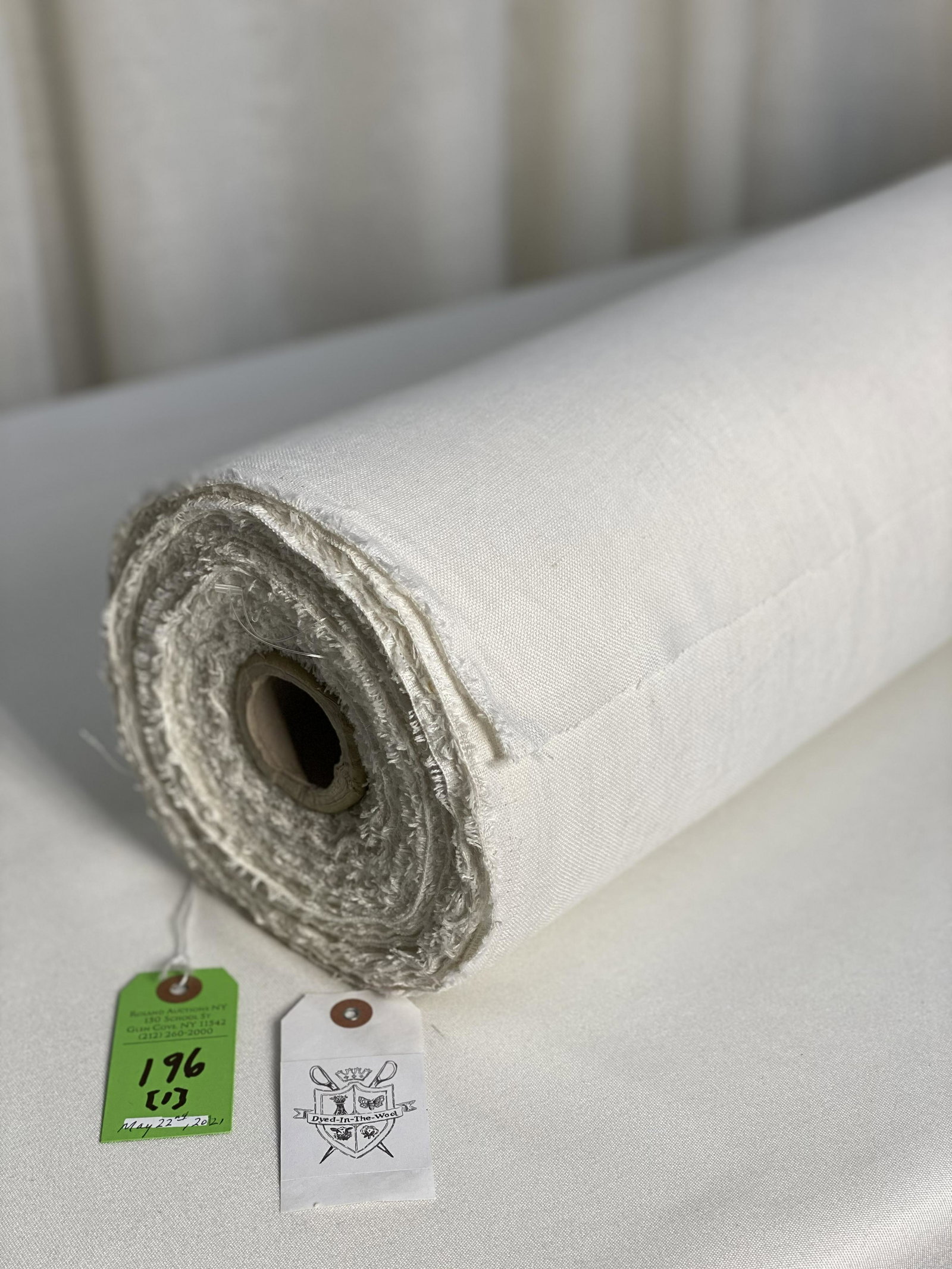 Off White Polyester Window Sheer Fabric: 65-yard bolt of a polyester sheer for curtains, 54 1/2" width. The slightly off white faux linen is a traditional width, and is in great condition.