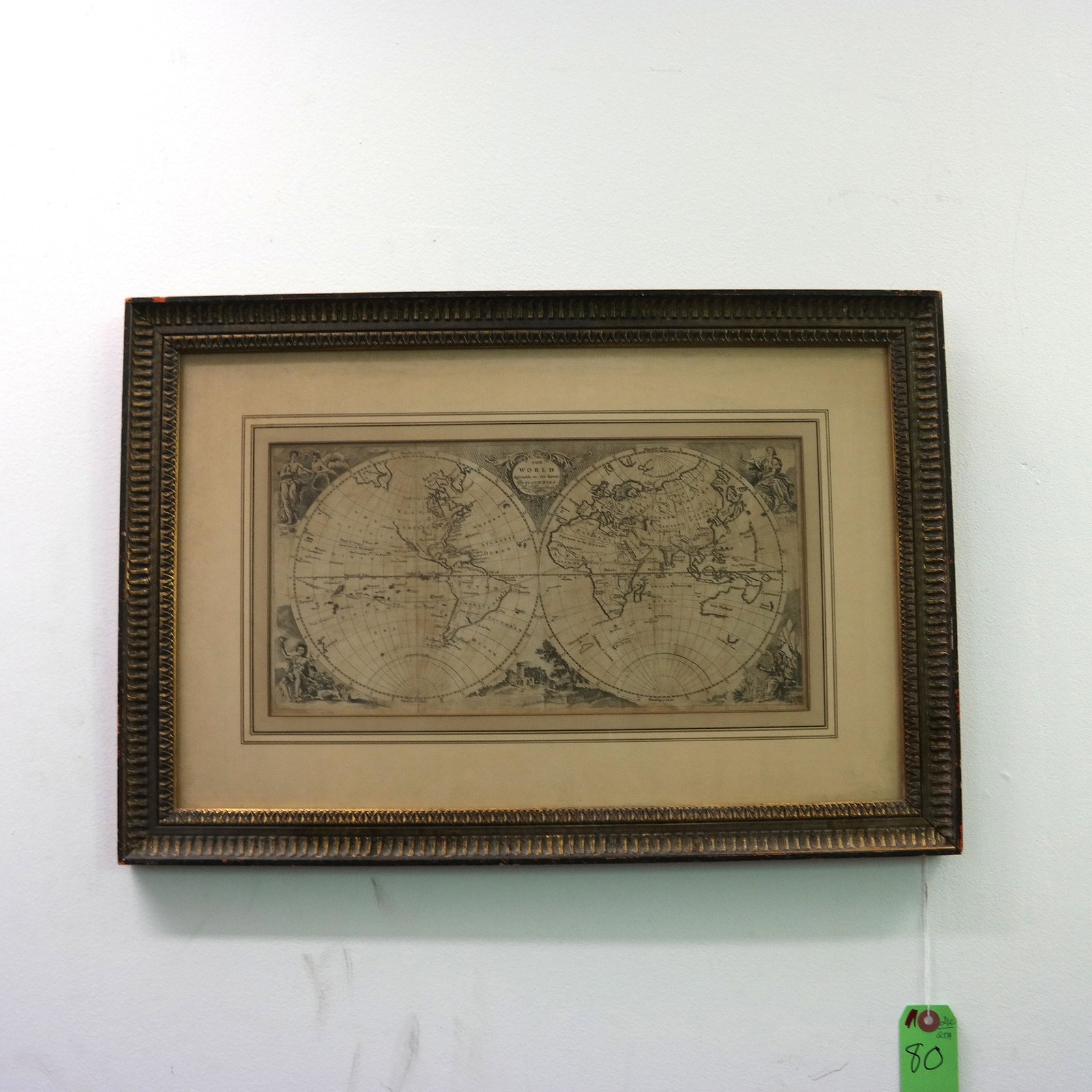 Antique Map of the World: Antique map of the world by The Phinn Sculpture Co. [Sight: 7 1/2" H x 15" W; Frame: 16" H x 24" W]. In good condition.