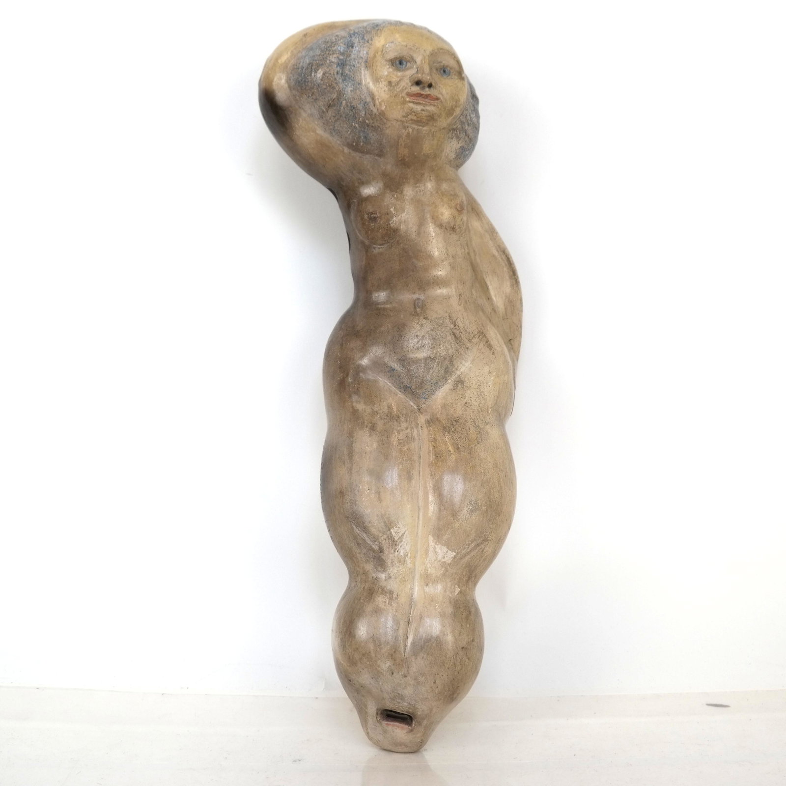 Eric Randle Nude Lady Ceramic Flute: Ceramic flute in the form of a nude reclining woman. Signed. [15 1/2" L].