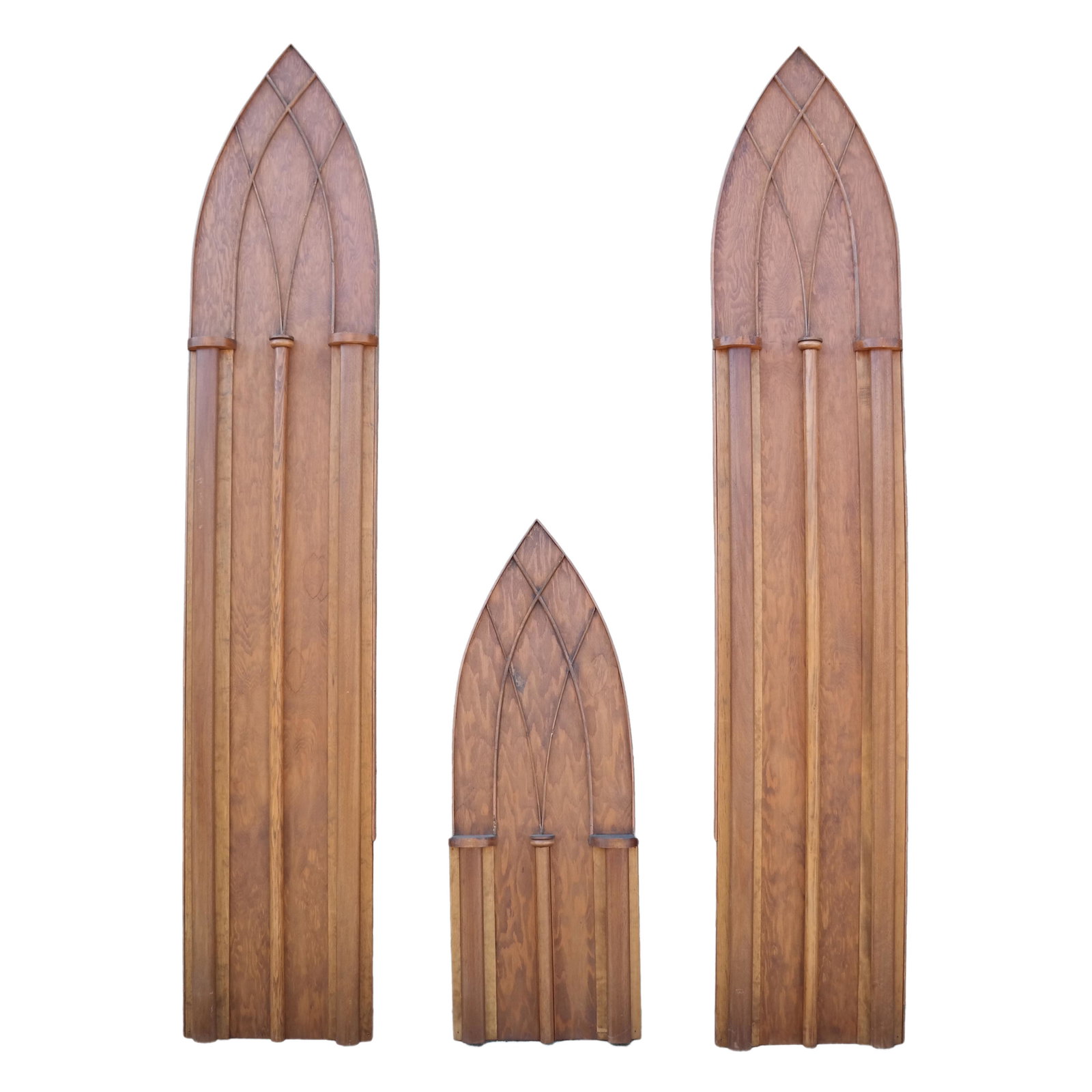 Three Carved Oak Gothic Arched Panels: Three carved Gothic arched oak panels, each with three applied half columns. [96" H x 17 1/2" W x 2" D (x2); 48" H x 17" W x 3" D (x2)]. In good condition.