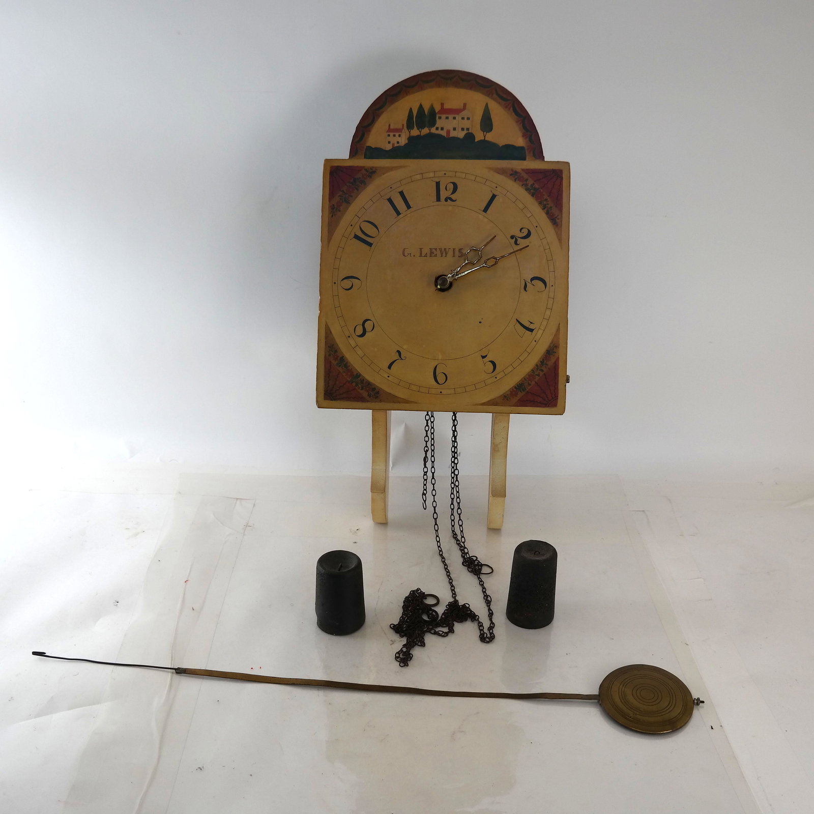 American Open-Face and Pendulum Clock: Painted face by G. Lewis, open weights and pendulum. [Approx. 40" H x 12" W x 8" D]. In good condition.