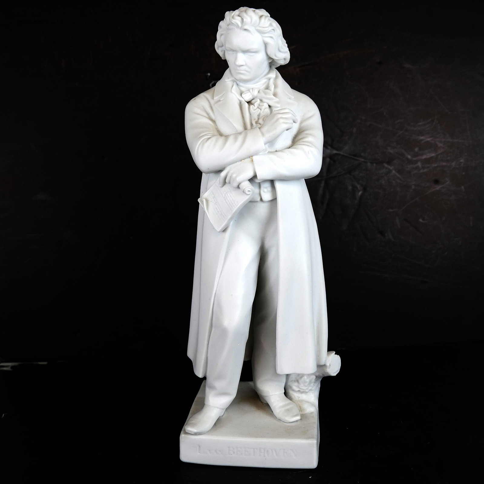 Continental Parian Sculpture of Beethoven: A Parian porcelain sculpture figure of Beethoven holding a book. [16" H x 5" W x 5" D]. In good condition.