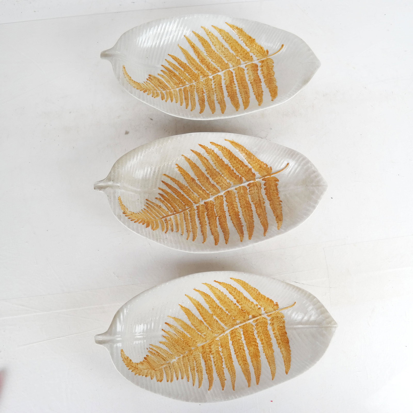 Set of Three Mottahedeh Fern Dishes: Elongated dishes, with sticker on bottoms. Provenance: From the Upper East Side estate of a prominent NYC interior decorator. [11" H x 6" W].