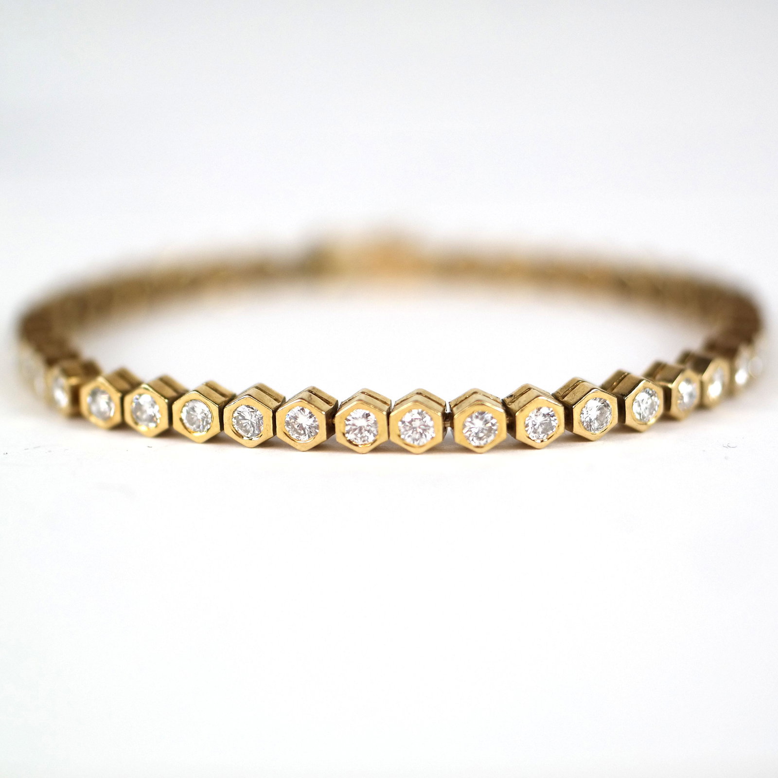 Tiffany Diamond Tennis Bracelet: 18K yellow gold tennis bracelet, with 42 diamonds, stamped "Tiffany & Co.". 17.4 grams, inclusive.