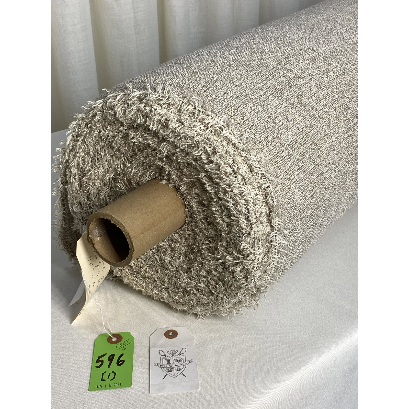 Two-Tone Modern European 118" Sheer Fabric: 27 yards of a heathered European woven window sheer with light oatmeal colored polyester blended yarns. Excellent quality! Has a mid-century vibe from the textured yarns and size of the grid. Hang ver