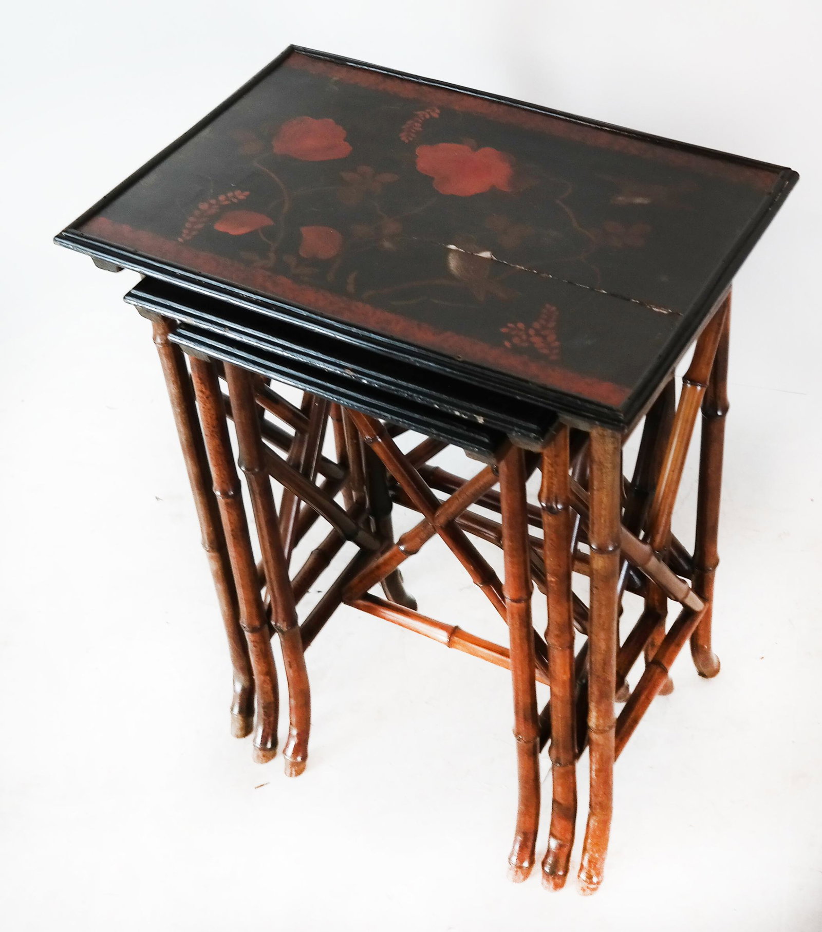 Asian Decorated Nest of Three Tables: Bamboo nest of three tables, with floral design, early 20th century. [26" H x 20" W x 10" D]. Splits.