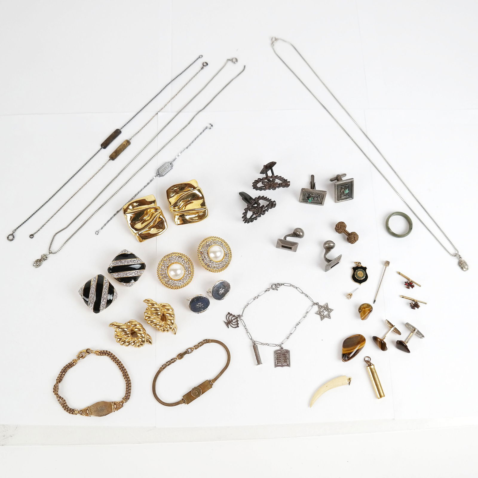 Lot Costume, Sterling Silver & Designer Jewelry: Lot of costume and sterling silver jewelry includes a pair of Givenchy gold-tone clip-on earrings, a pair of sterling silver cufflinks and a sterling silver Star of David necklace.