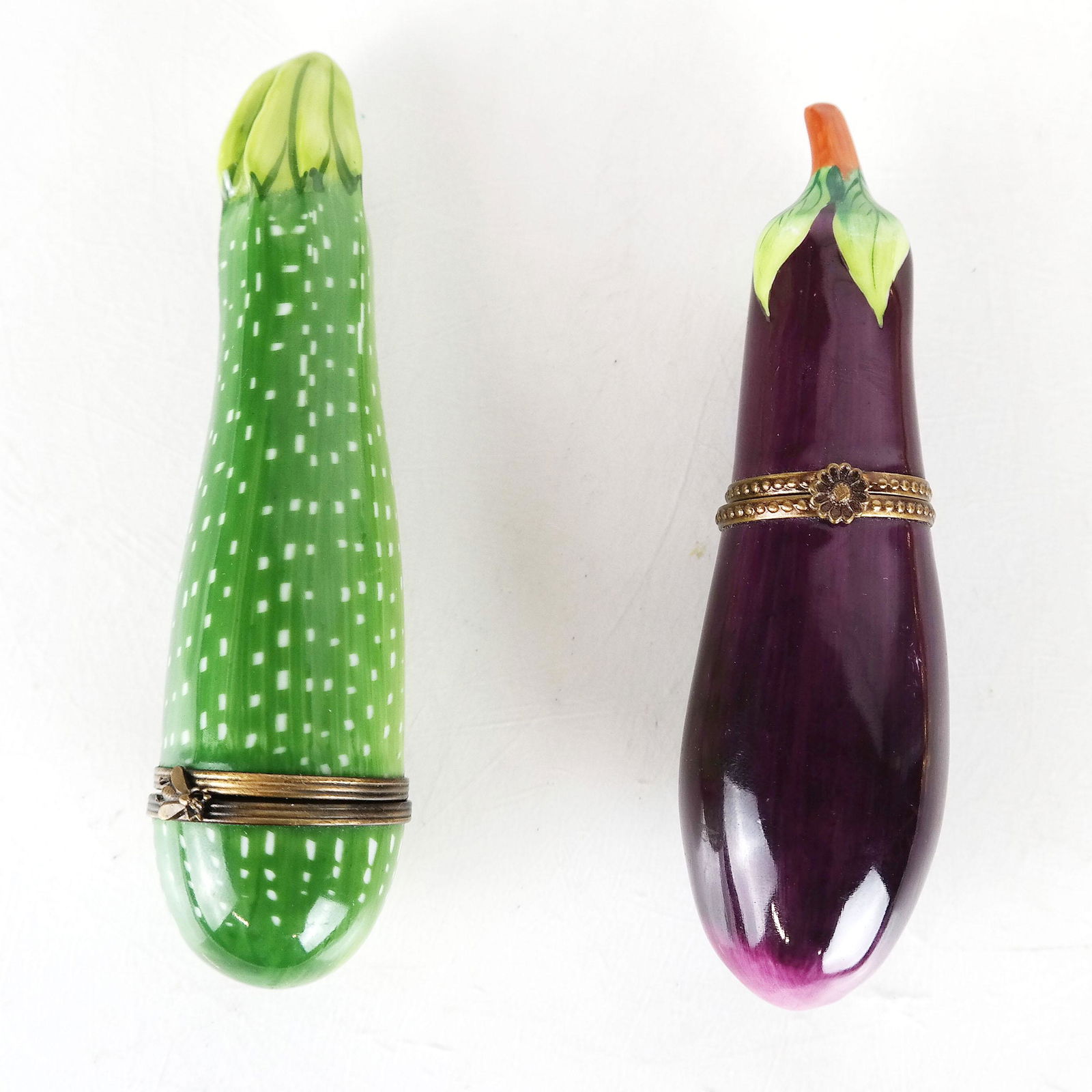 Limoges Rochard Pickle & Eggplant Boxes: Hinged trinket boxes in enamel and porcelain, by Rochard for Limoges. [5" L]. In good condition.