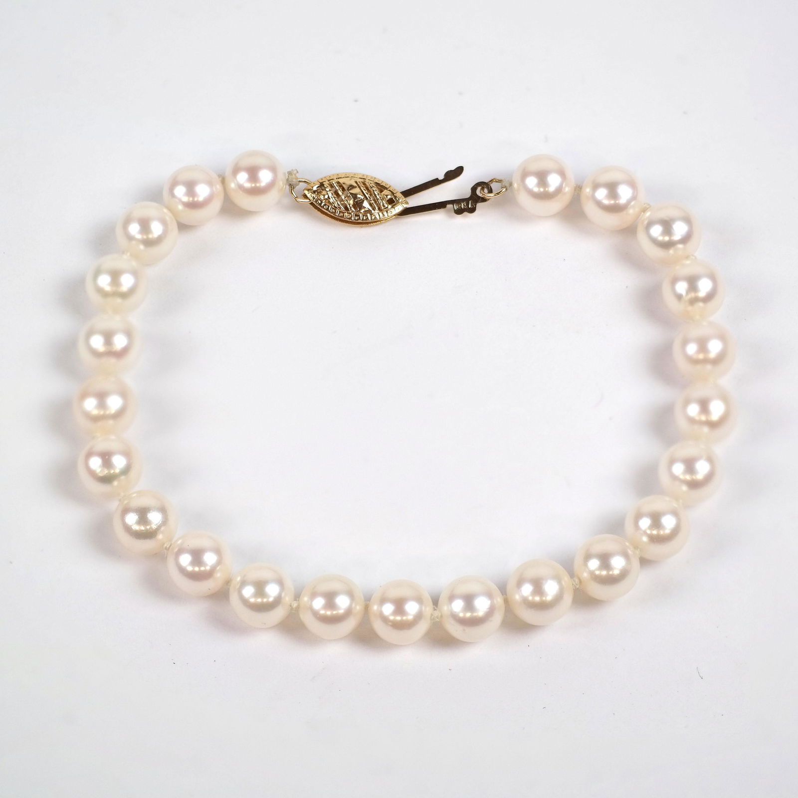 Pearl Bracelet: Pearl bracelet, stamped 14K.