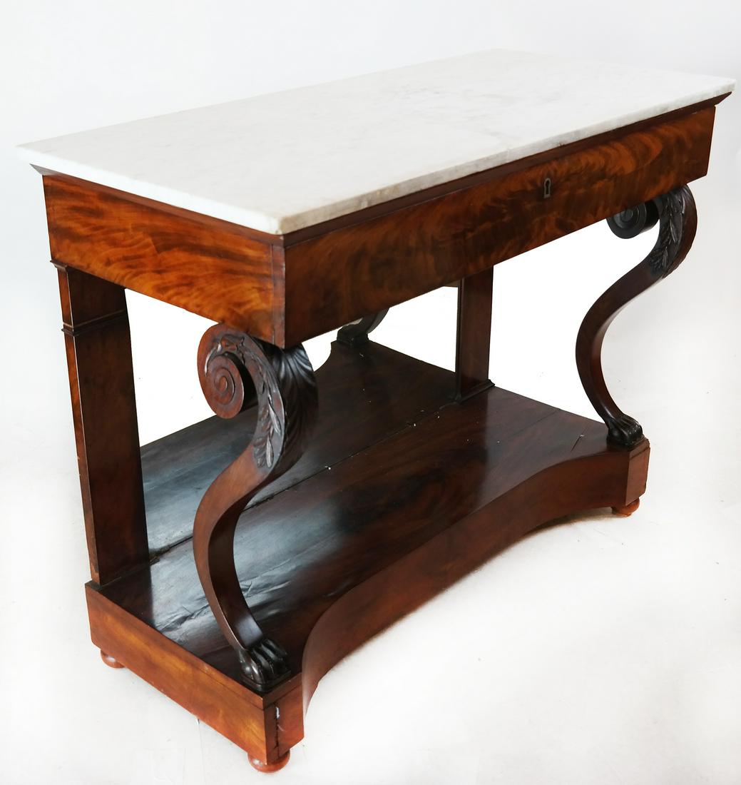Mahogany Empire Console with Mable Top: English Empire mahogany console with mirrored base and marble top. [Overall: 34 1/2" H x 43 1/2" W x 20 1/4" D]. Splits.