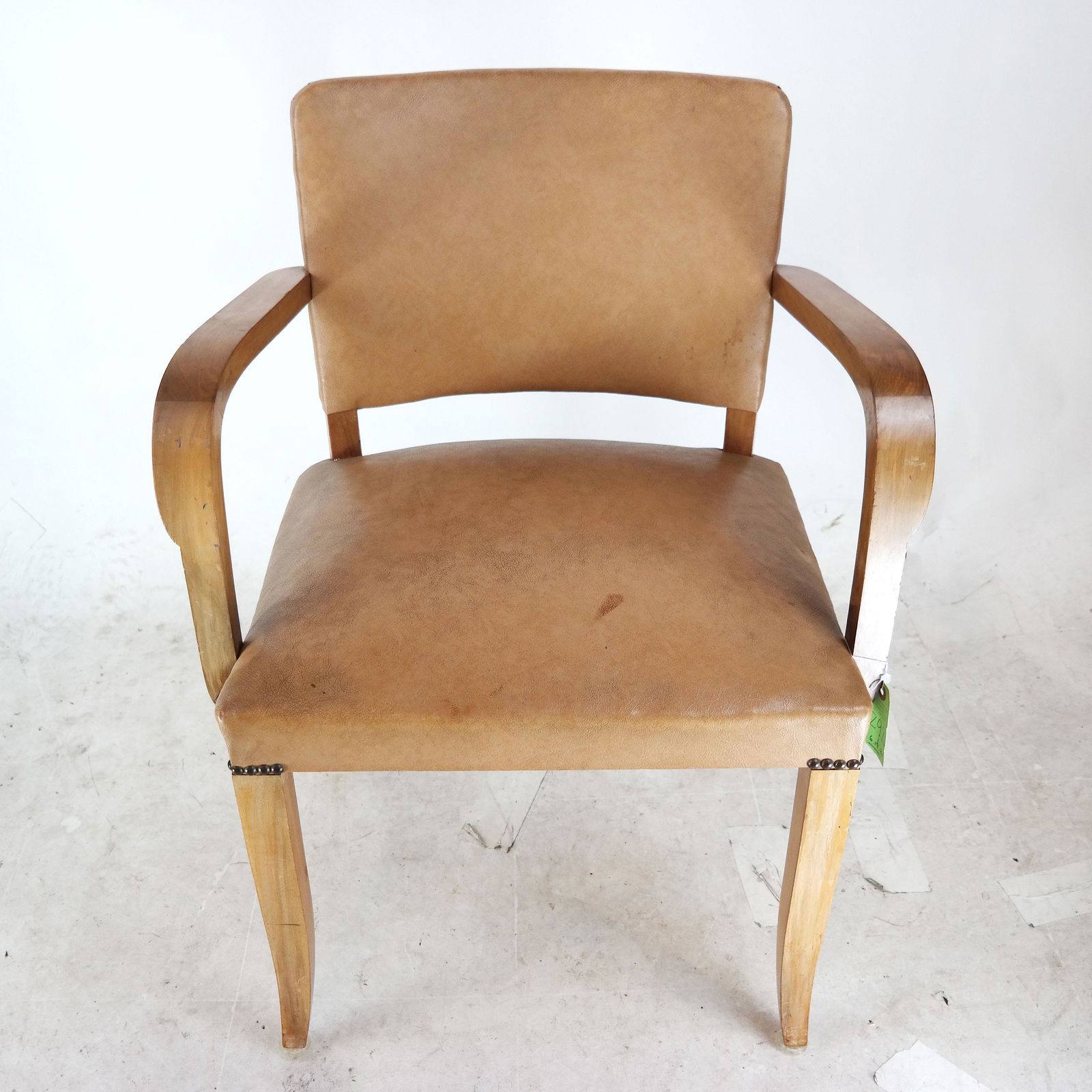 Han Wegner Manner Arm Chair: Danish Modern teak chair, with brown leather upholstery. [34" H x 25" W x 21 1/2" D]. In overall good condition.