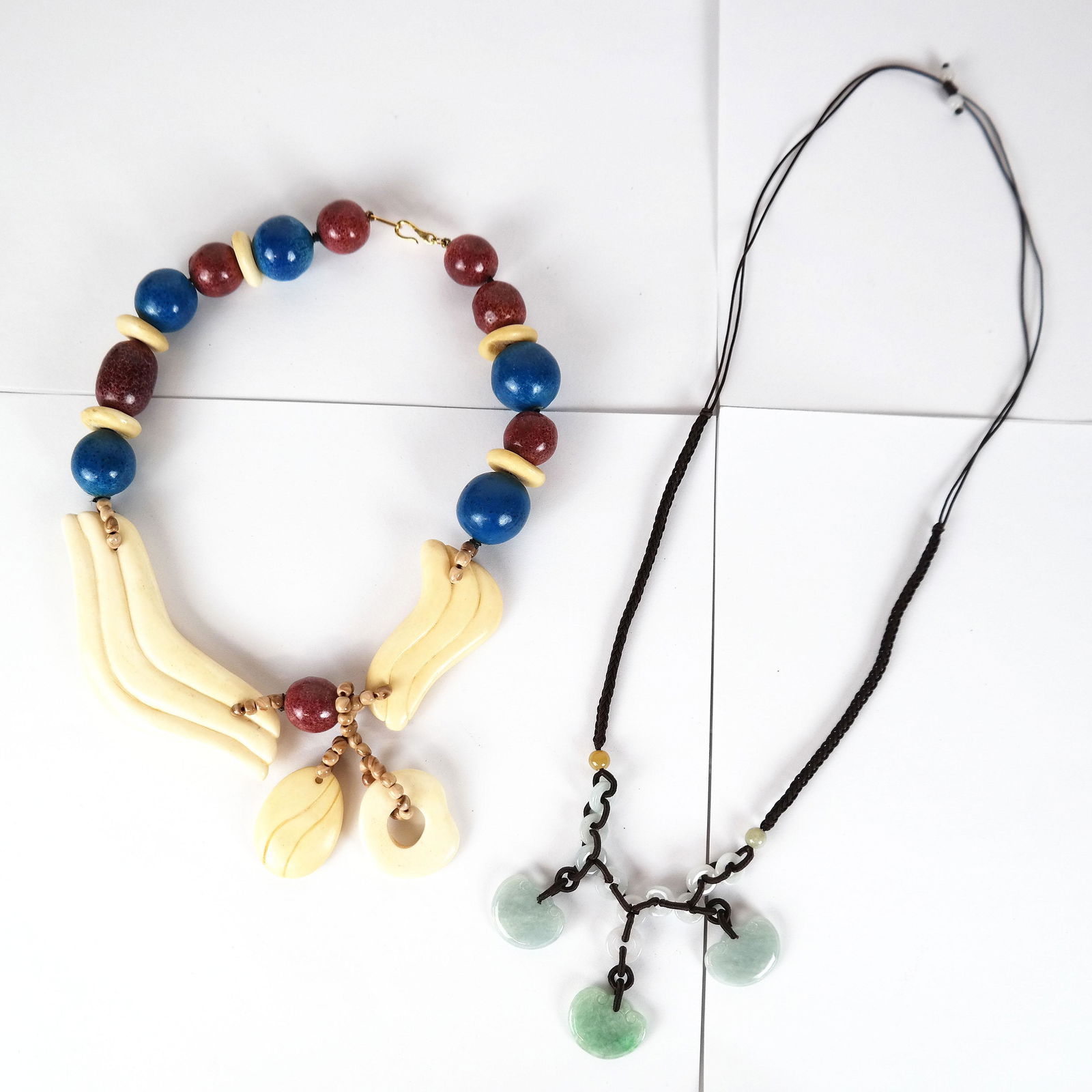 KYL Statement Necklace & Jade Pendants Necklace: Kai Yin Lo faux bone and large bead "statement" piece, marked "KYL" on the clasp [16" L], together with a necklace of 3 light green jade discs suspended from interlaced jade rings on a black silk cord