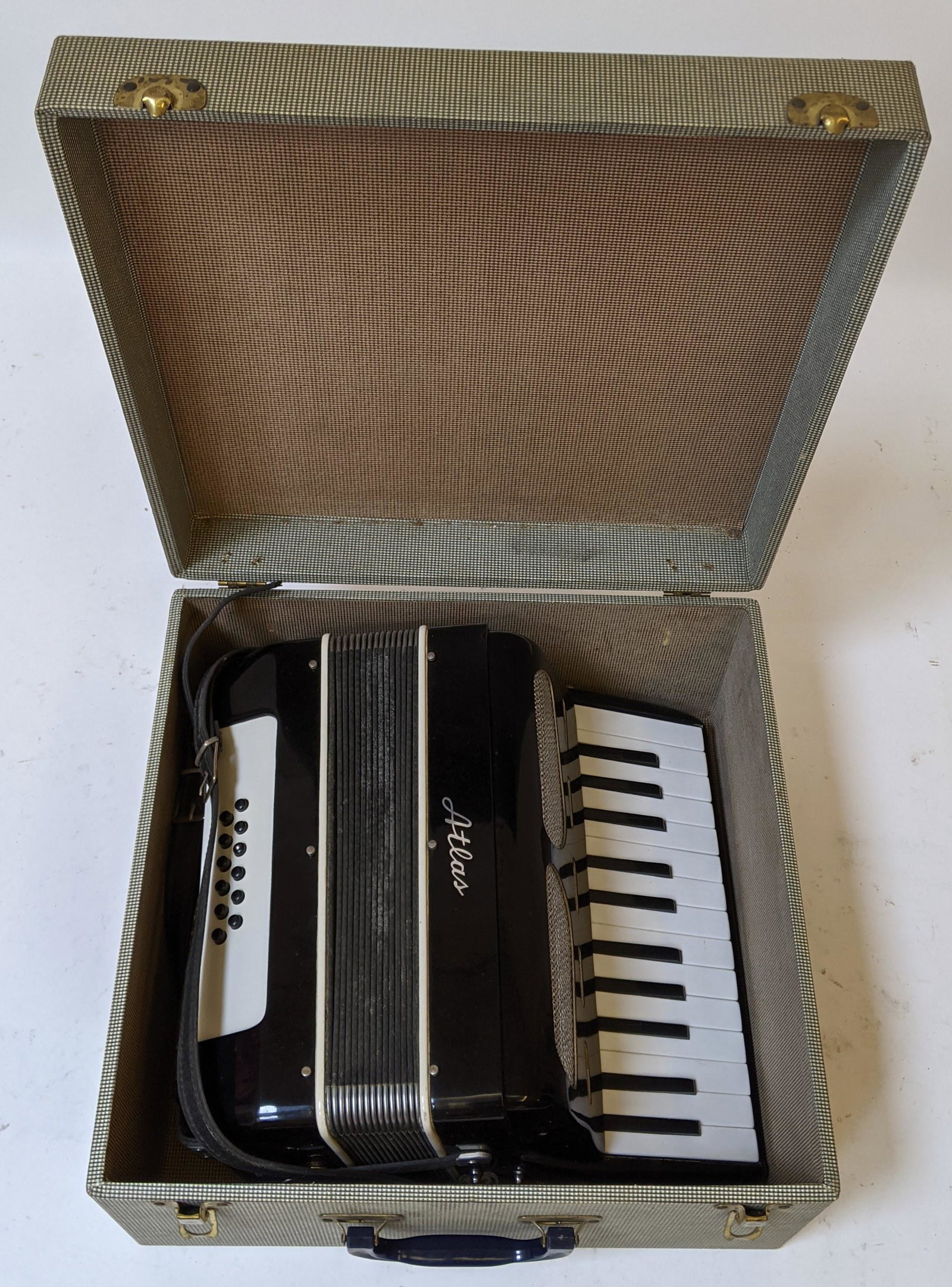 Atlas Americana Accordion: Atlas Americana accordion, black, in original box. [8" H x 15" W x 15" D].