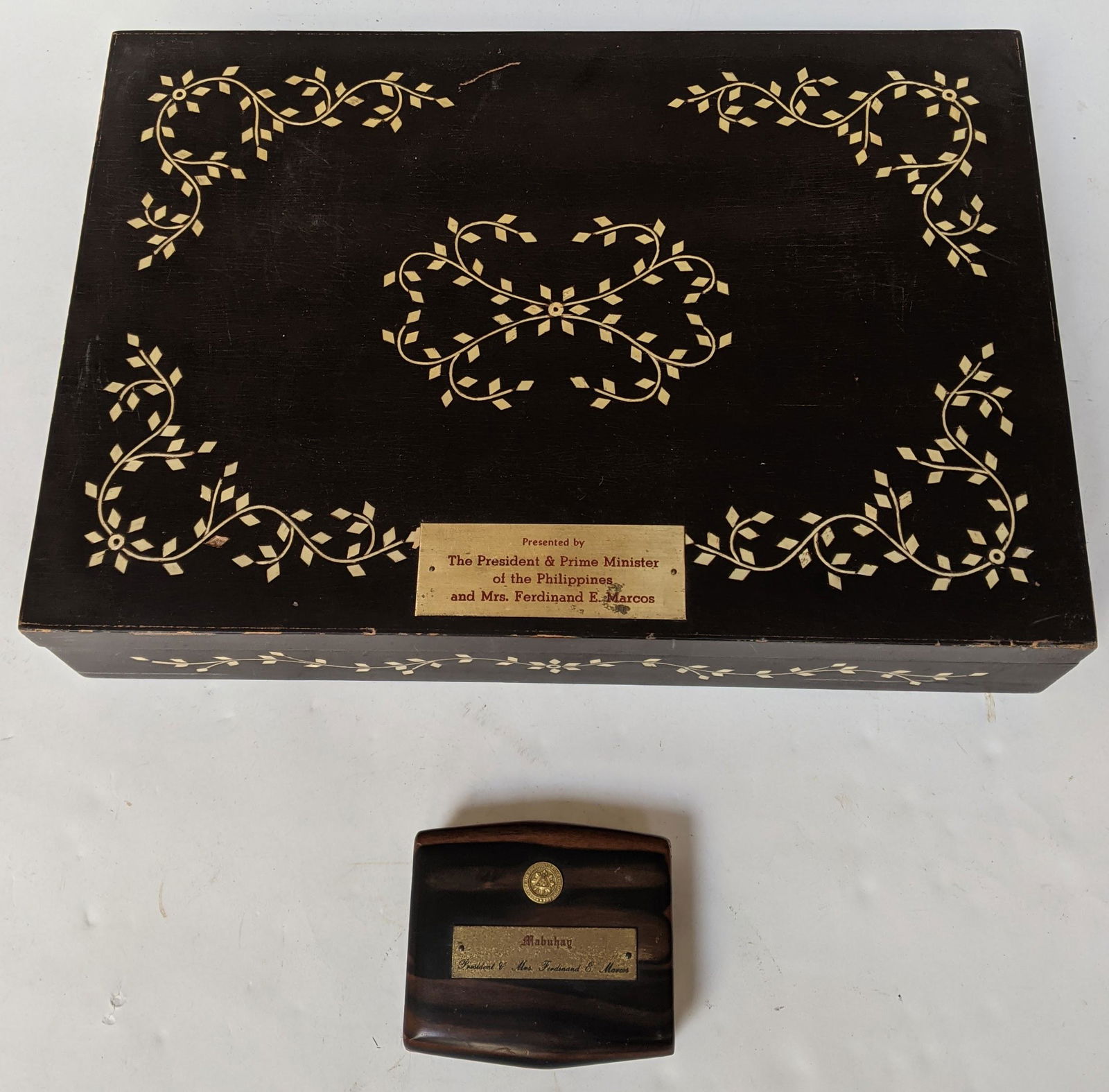 Two Presentation Boxes from Ferdinand Marcos: Two boxes, one inlaid, both presented to Lester Wolff by President and Prime Minister Ferdinand Marcos. [Slightly larger: 13" H x 19" W x 4 1/2" D] In good condition.